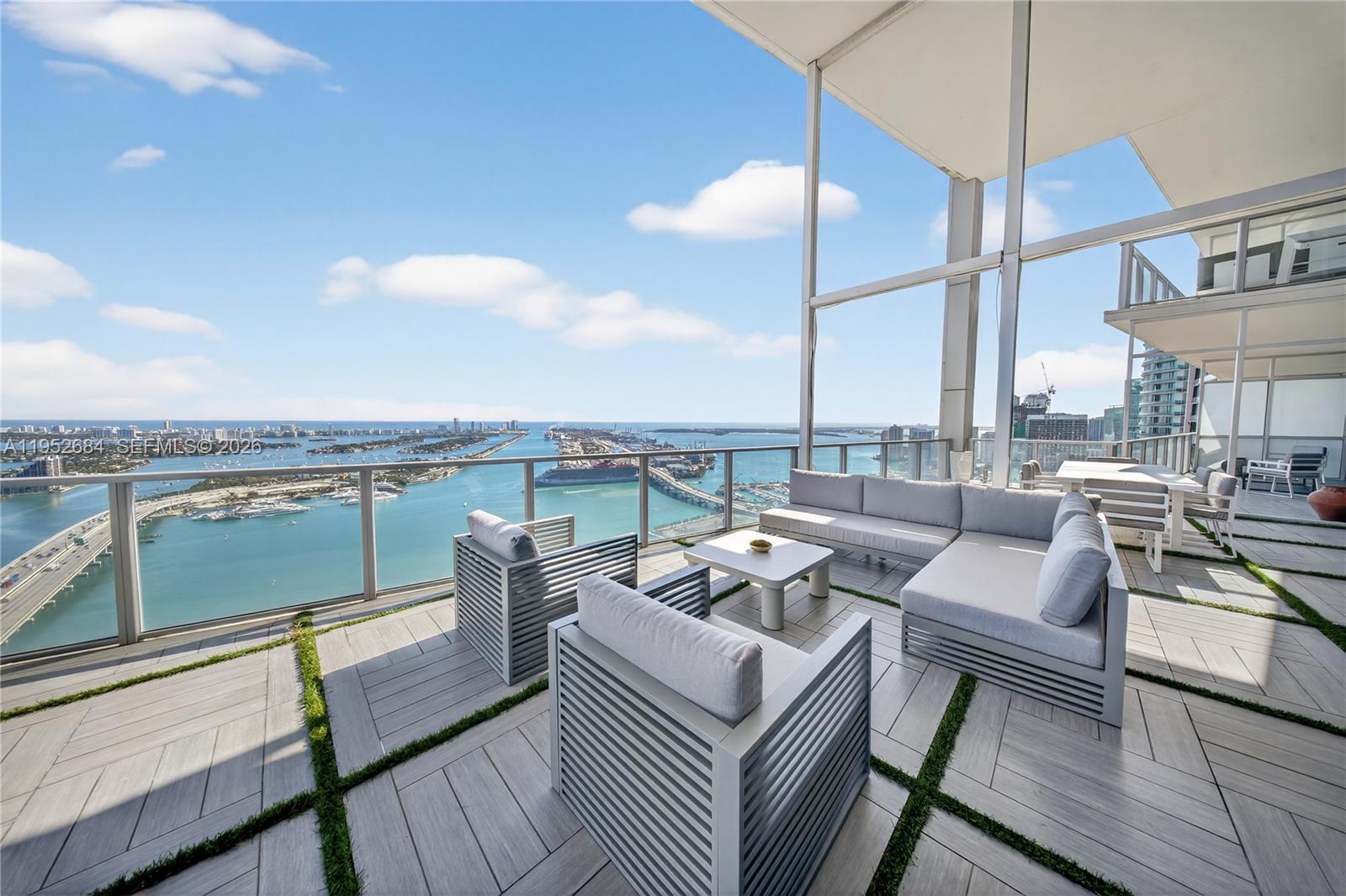 A Private Sky Estate at Marquis Residences Oceanfront Trophy Living.Rising above the Miami skyline, this extraordinary combined residence offers nearly 7,000 square feet of refined interior living space with unobstructed ocean and skyline views and the best price per square foot in Downtown Miami’s luxury segment. Seamlessly integrating three residences (5306, 5305 & 5304), this one of a kind home features 6 expansive bedrooms, 6 full bathrooms, and 2 half baths, designed for elevated living at the highest level. Walls of floor to ceiling glass frame breathtaking panoramic views, flooding the residence with natural light and creating an ever changing backdrop of water, sky, and city lights.
The primary suite is a private retreat in the sky, offering incredible panoramic views and its own dry sauna for a true spa-like experience. A dedicated theater room and a stunning main level executive office with spectacular open views provide both comfort and functionality within the home.
Grand living areas flow effortlessly for large scale entertaining while maintaining warmth and intimacy. This is high rise living without compromise scale, privacy, and presence rarely found in the sky.
The residence includes 4 assigned parking spaces and access to the full service lifestyle of Marquis. Ideally located in the cultural and financial heart of Miami. An irreplaceable opportunity to acquire a trophy-scale residence at unmatched value per sft. Cryptocurrency transactions are welcome.