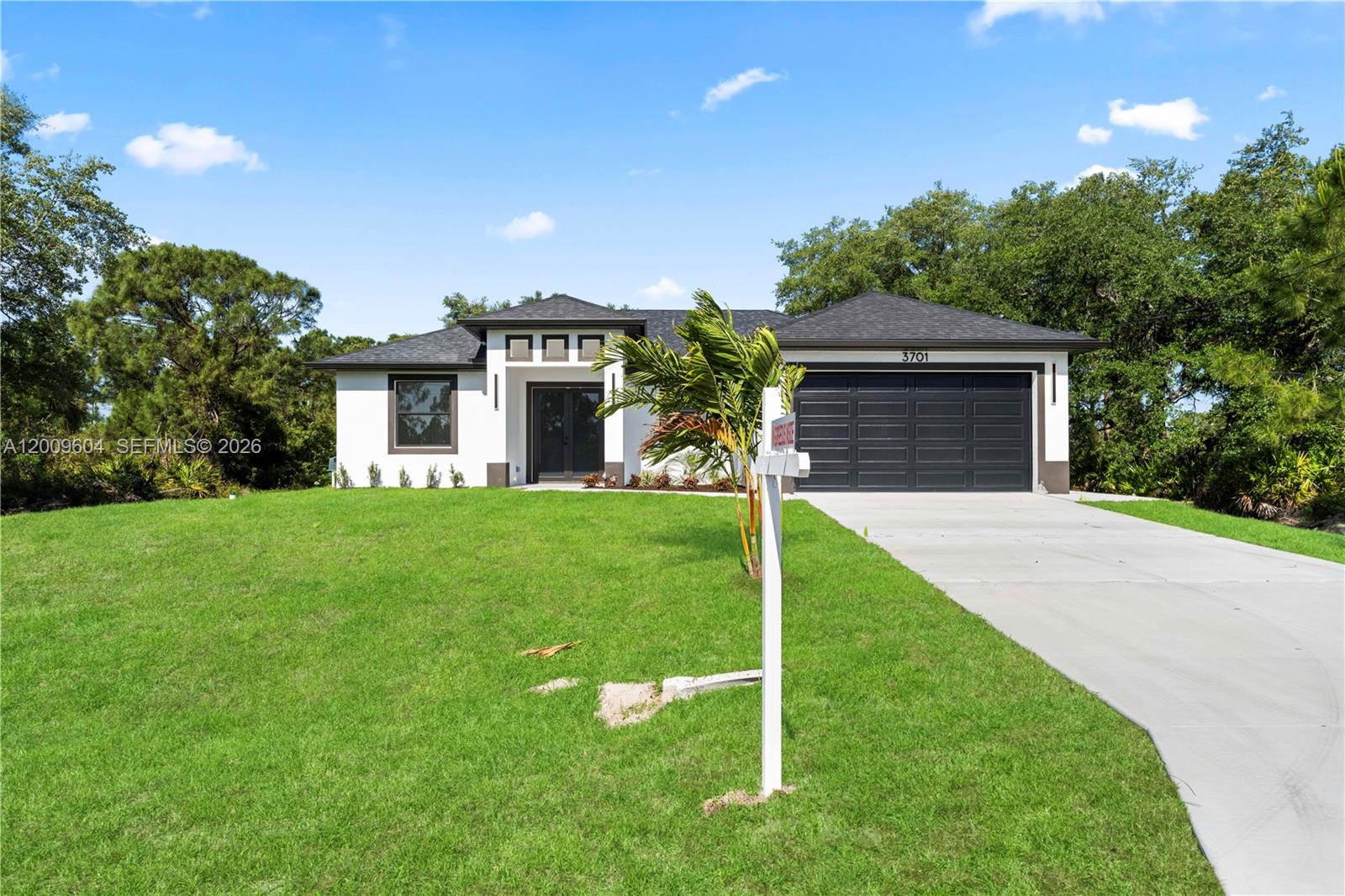 PRICE IMPROVEMENT - Discover modern living in this brand-new 1-story single-family home in Lehigh Acres! This 3BD/2BA residence offers over 1,500 sq ft under air with a bright open-concept floor plan, fully tiled throughout with a sleek and modern  finish. The designer kitchen features quartz countertops, stainless steel appliances, and a spacious island perfect for entertaining. Enjoy impact windows and doors, a dedicated laundry room with washer & dryer included, water filtration system, 2-car garage, extended driveway, patio, septic tank, and a generous .25-acre lot with no HOA restrictions. Seller is offering $5,000 toward buyer’s closing costs and prepaids — an incredible opportunity for homeowners and investors alike!