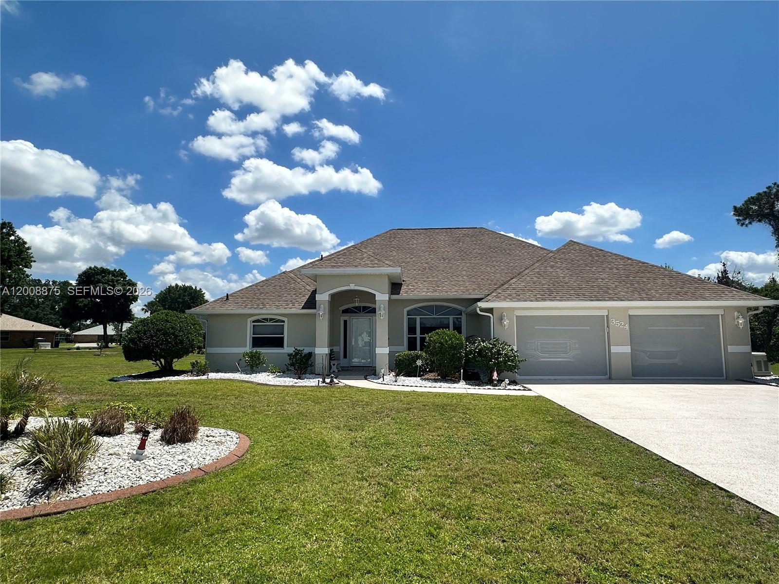 Beautifully maintained home in the desirable Manor Hill section of Sun ‘N Lake—perfect for buyers relocating to South Central Florida. Located in a higher elevation area, this property offers added peace of mind with no flood insurance required. This spacious 3-bedroom, 2-bath residence offers over 2,600 square feet, including a 35x11 all-seasons room, and sits on a generous 0.37-acre lot—providing more space and privacy than typically found in more densely populated areas. The home features a functional layout with a dedicated laundry room and an oversized 2.5-car garage, complete with a side-entry golf cart bay, built-in workbench, cabinetry, and ample storage for hobbies or equipment. The extended driveway accommodates up to four vehicles, and professionally maintained landscaping enhances curb appeal. Recent updates include a new roof (2022) with third nail for potential insurance savings, new HVAC (2023), whole-house generator (2023), all new GE appliances, and a screened room added in 2023. Interior and exterior were freshly painted in 2025, and the home features seven new remote-controlled ceiling fans (2026). Finishes include porcelain tile and marble-look luxury vinyl plank flooring throughout.
Sun ‘N Lake offers two championship golf courses, tennis and pickleball courts, a community pool, and a playground. Memberships are optional. Conveniently located with access to both coasts, this home offers a peaceful lifestyle with everyday convenience.
