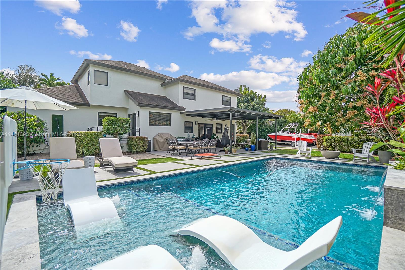 Discover your dream home! This stunning 2-story residence boasts impressive features including impact windows and doors, ensuring your peace of mind. Its unbeatable location near major highways guarantees effortless commuting. With a spacious bedroom on the ground floor, versatility is at your fingertips. Step into your backyard oasis, complete with an oversized heated pool for year-round enjoyment. Plus, the added convenience of a 1-car garage in the backyard and ample parking space completes this exceptional offering. Don't miss the chance to call this gem your own!