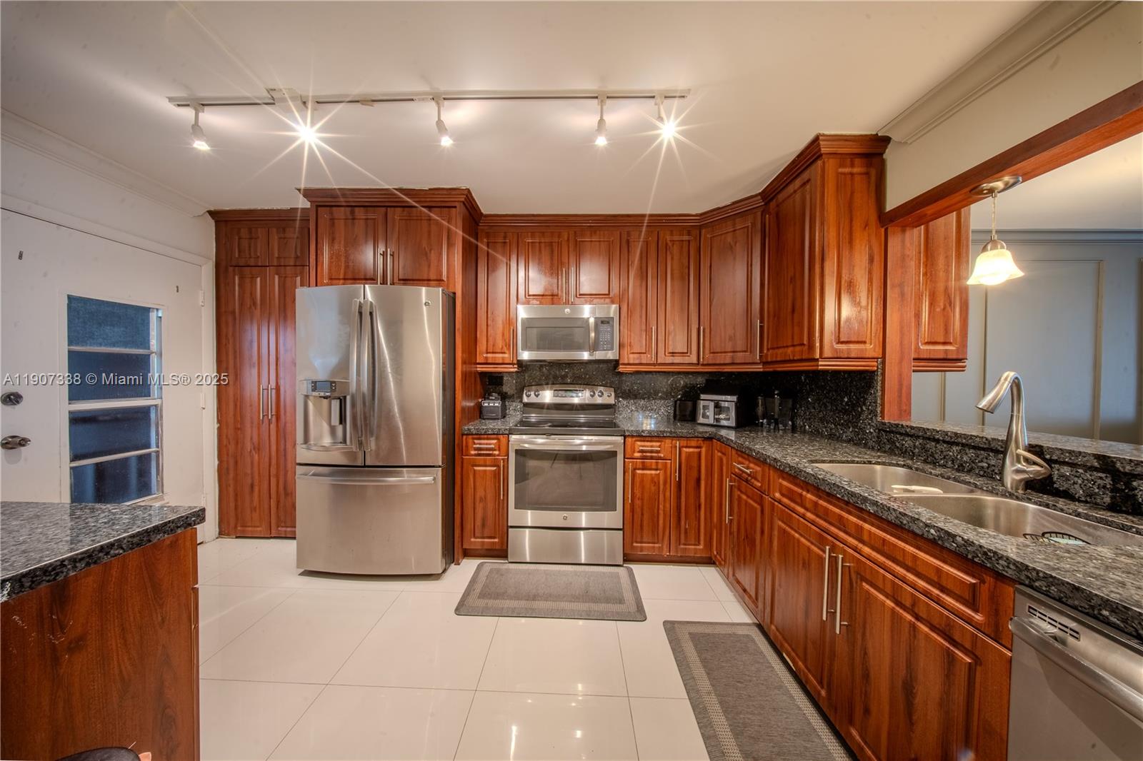 BEAUTIFULLY REFRESHED: FURNISHED AS IS  2 BEDROOM 2 BATH, MOVE IN READY ON THE 4th FLOOR IN A CENTRALIZED LOCATION! Unit features versatile flex space and a screened balcony facing the tranquil lake.  Delight begins the moment you step into the foyer and are greeted by the airy open space. The relaxing view from the balcony exudes peacefulness! The Kitchen features Stainless Steel appliances and granite countertops. Plenty of storage space throughout.  OF VALUE- storage unit is available outside. 1 assigned + 1 open parking. Laundry facilities same floor as the unit. The complex offers 3 pools. EXCELLENT location close to shopping and dining. It is a guard-gated community with 24-hour security.  40-YEAR CERTIFICATION. CREDIT SCORE 675+,PET FRIENDLY, OK to lease after 1 year!