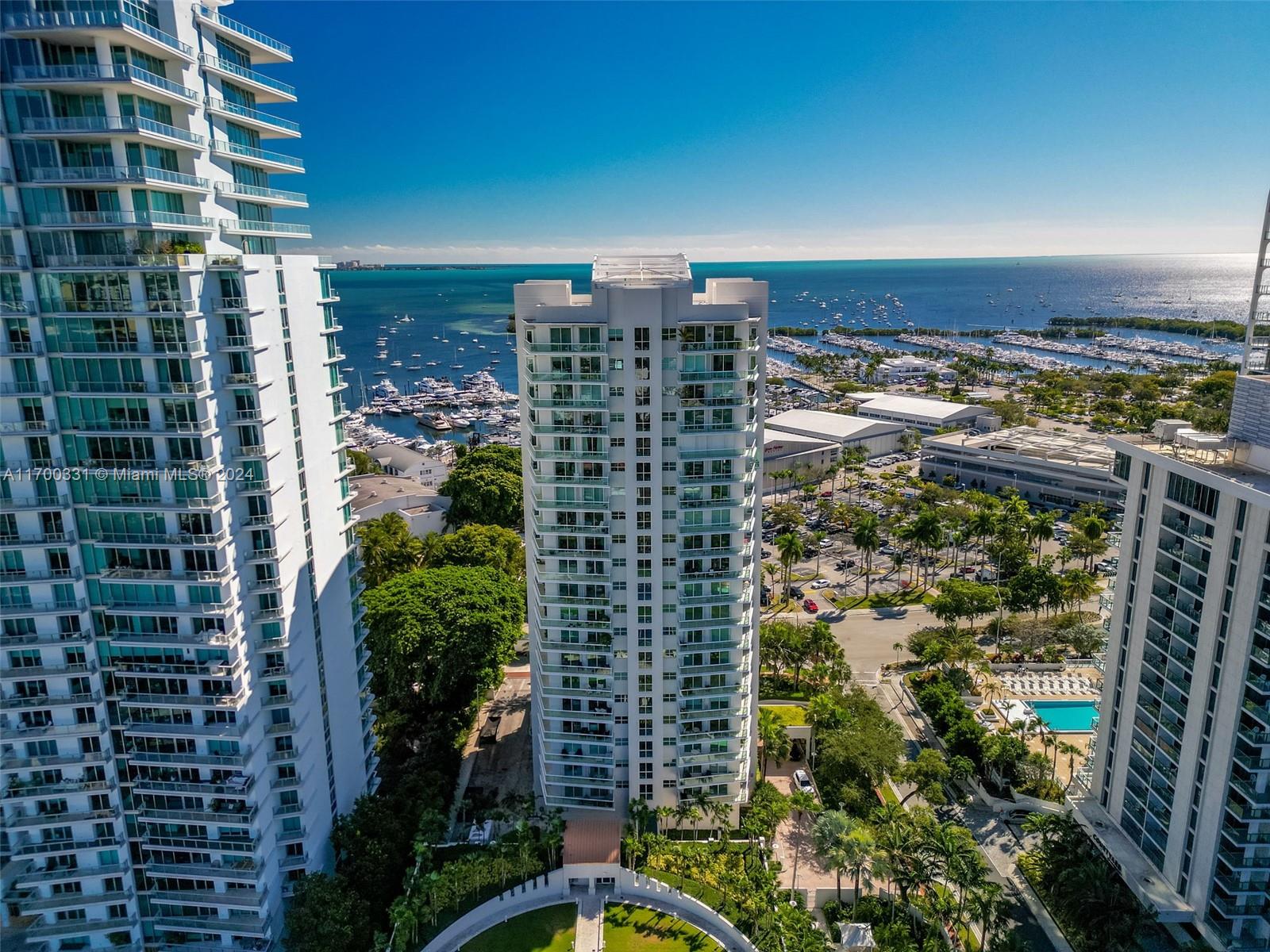 Enjoy the lifestyle of living in one of the residences at the Grove Hill a sought out boutique building in Coconut Grove you will see a view from every window and a wrap around balcony.  Every room has access to private  balcony.  The corner unit residence offers plenty of space, great for entertaining.  The building offers great amenities with 24 hour security, valet service, tennis and pickle ball courts, pool, playground, gym, sauna.  Take a walk to restaurants, waterfront marinas, shops and grocery store. The residence comes with 2 parkings and storage.