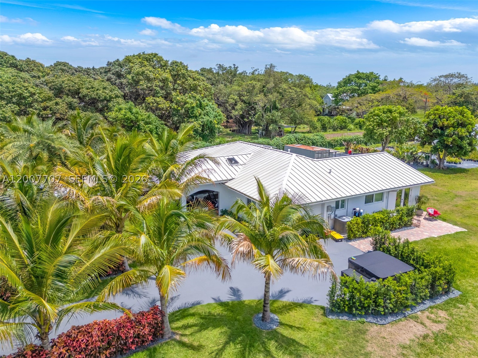 location, location, location... EAST REDLAND THE UDB IS LOCATED EAST SIDE ON 137 AVENUE WE ARE 13770. LAND BANKING IS STRONG POSSIBILITY.THIS IS AN AMAZING STREET DIVERSIFIED WITH  AGRICULTURAL PROPERTIES TO INCLUDE ESTATES, HUGE HI END WALLED COMPOUNDS CURRENTLY BEING BUILT, ORGANIC PRODUCE, FRUIT TREES AND GARDENS, AND OF COURSE A SELECTION OF EQUESTRIAN FACILITIES. THIS AGRICULTURAL COMPOUND IS SITUATED ON 5.5 ACRES. SHES A 4/3  SPLIT PLAN W PORTE COCHERE THE HOME PLACEMENT ALLOWS MAX LAND USAGE. (FRONT AND CORNER) ELEC GATES ALLOW ENTRY INTO THE SEPERATED EACH APPROX 2.75- THE CROSS FENCING SEPERATES THE LAND INTO 2 PARCELS OF USAGE.BOTH WITH PRIVATE ENTRYS. THE WEST FORMER NURSERY,.CURRENT MONTH TO MONTH TENANT., ALSO HAS ASST FRUIT TREES ON SITE. SHES A BEAUTY AGAIN THE LOCATION IS A PLUS IN REGARDS TO TRAVEL TIME AND FUTURE GROWTH POSSIBILITIES.