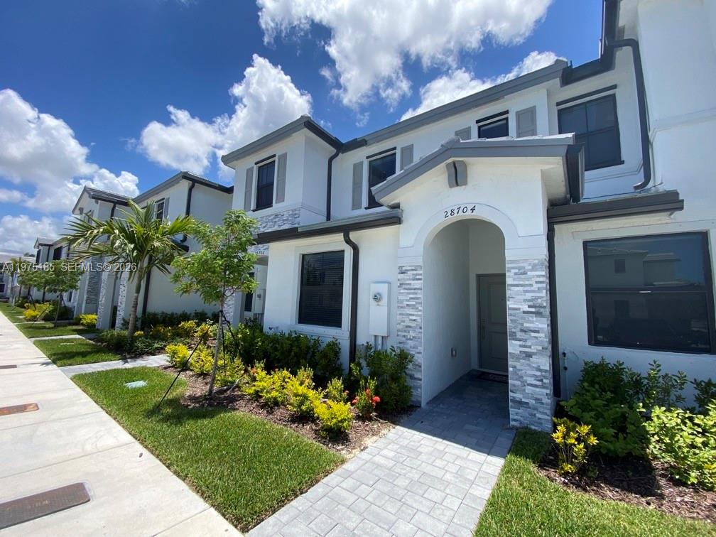 **INVESTOR SPECIAL** Leased through 4/2027, with a tenant already in place. A ready-made rental that starts paying on day one. **HOME FEATURES** Home has two master suites upstairs, one bedroom and full bath downstairs. The first floor features a fully tiled space with an open layout, combining the family room, dining area, and kitchen with stainless steel appliances. Two assigned parking spots right in front of the unit, gated community with a clubhouse, fitness, pool and kid-friendly play areas. Two huge shopping centers with restaurants down the street at walking distance.