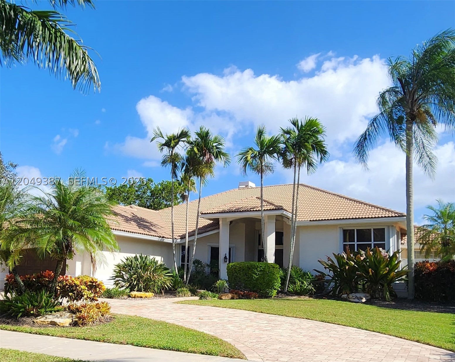 Beautiful 5 Bedroom, 4.5 Bathroom home, with a large pool in the prestigious community of Palm Island, where homes are rarely available. This spacious one-story home offers a split floor plan, high ceilings, and a huge kitchen with a chefs dream center island and family room that's perfect for everyday living and spending time with family and friends. The flexible layout offers endless possibilities to update and customize the home to fit your style and needs. Enjoy a large screened patio, an expansive backyard, and a beautiful oversized pool, creating the perfect outdoor retreat. Additional features include impact doors, a wet bar, cabana bath, circular driveway, and many upgrades throughout.   Ideally located near Weston Town Center and within an A+ rated school district, this is a rare opportunity to own a great home in one of Weston's most desirable communities.  Must see!!