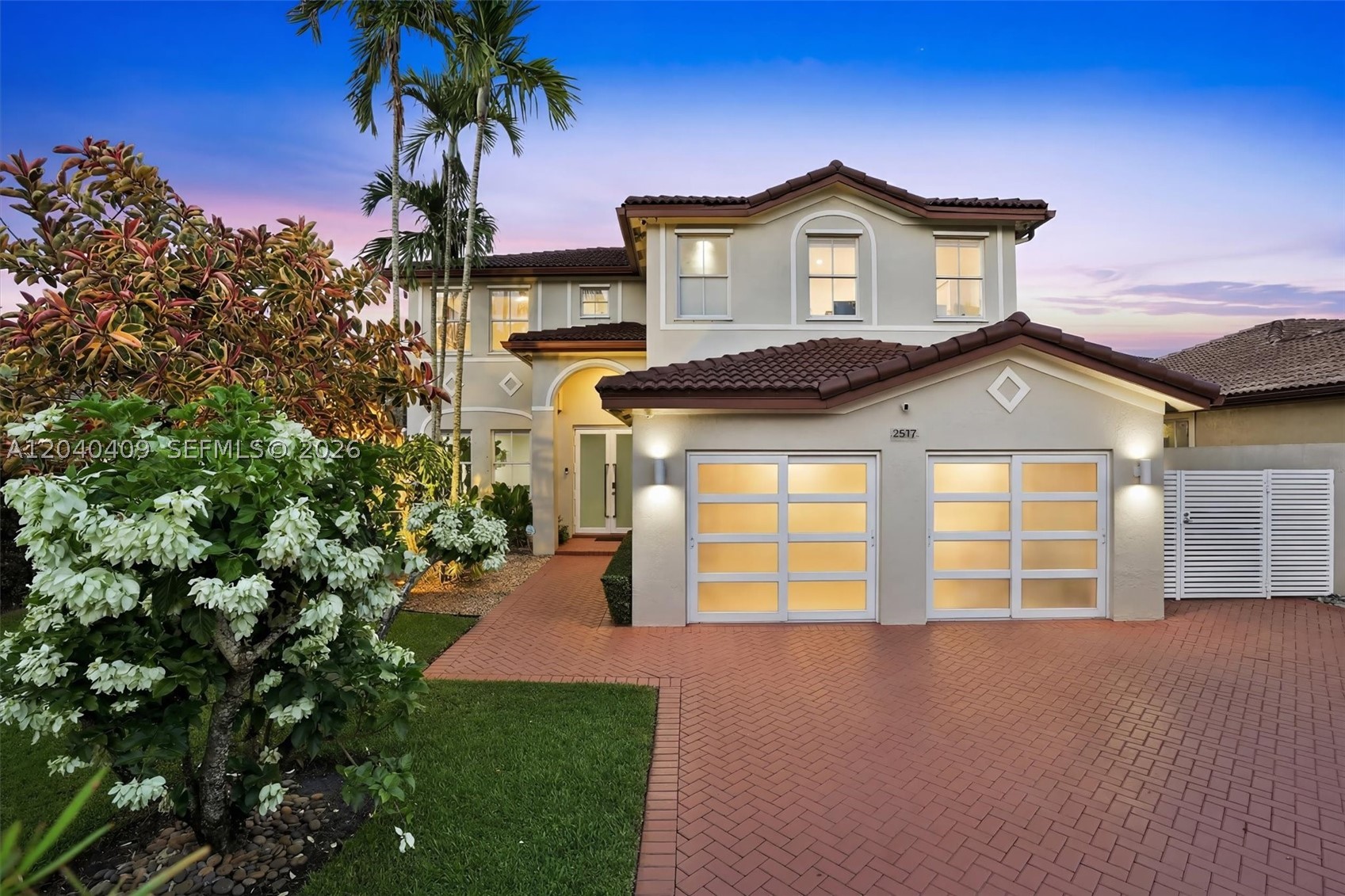 Experience luxury living in this stunning 5-bedroom, 3-bathroom residence featuring a private in-law suite, perfect for extended family or guests. Soaring ceilings, oversized windows, and an open-concept design fill the home with natural light and create seamless flow between living spaces. The updated kitchen features white cabinetry, granite countertops, and stainless-steel appliances.

The spacious primary suite offers a spa-inspired bath with a frameless glass shower and walk-in closet. Outside, enjoy your own tropical oasis with a sparkling pool, jacuzzi, covered patio, outdoor kitchen, and over 40 orchids—ideal for entertaining or relaxing.

Additional features include impact windows and doors, glass garage doors, whole-home audio with indoor and outdoor speakers, Wi-Fi throughout, network wiring in every room, Ring security cameras, alarm system, sprinkler system, lush landscaping, furniture included, and NO HOA. Ideally located near top-rated schools, parks, shopping, and dining, this exceptional home combines elegance, comfort, and modern convenience.