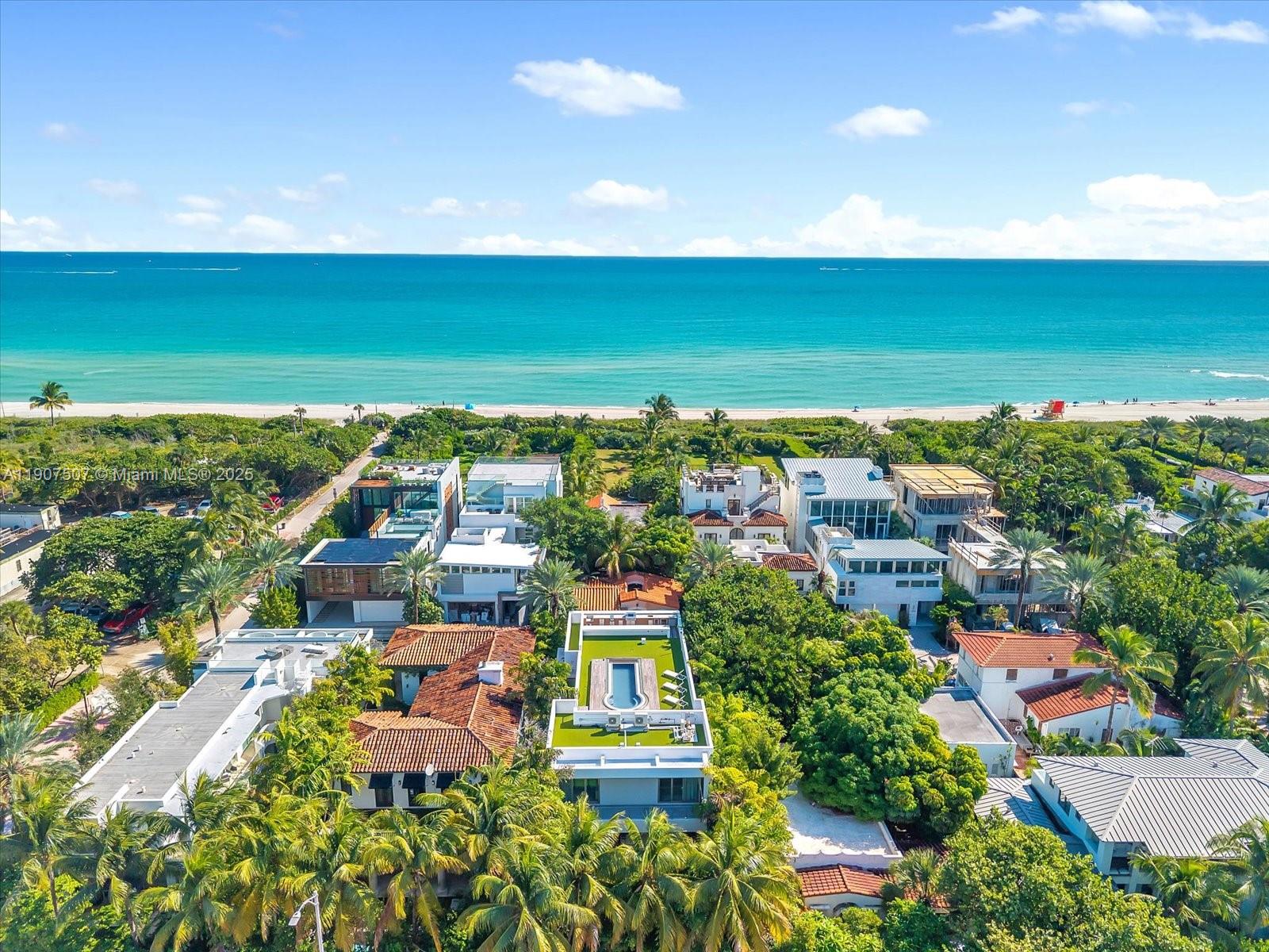 Experience Miami Beach luxury in the city’s only oceanfront community, an exclusive 24/7 guard-gated oceanfront enclave of just 23 private residences. Steps from the sand, this brand-new 3-bedroom, 3.5-bath contemporary masterpiece offers open-concept living with soaring double-height ceilings and floor-to-ceiling hurricane-impact glass, blending indoor and outdoor spaces. A custom chef’s kitchen, spa-inspired bedrooms, and designer finishes define elegance throughout. The private rooftop terrace with pool delivers breathtaking ocean and city views. Complete with a two-car garage, this home offers unparalleled beachfront living in Miami’s most coveted community.