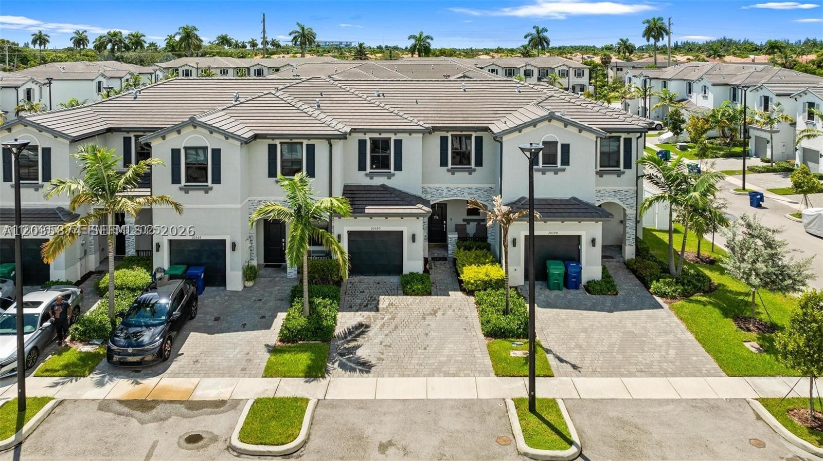 Stunning & spacious 3 bed/2.5 bath townhome located in Vista Lago, one of Miami's most exclusive gated communities. Upgraded tile throughout first floor. 1 car garage. Great chef's kitchen features tall cabinets & top-of-the line stainless steel appliances. Fiber OPTIC CABLE for maximum high speed internet. Washer & dryer. Vista Lago features resort-style amenities including a sparkling pool, fitness center, clubhouse, playground, guest parking, and 24/7 security. Ideally located near Hard Rock Stadium, parks, schools, shopping, dining, and with easy access to Florida’s Turnpike, US-441, and I-95. Perfect for families, professionals, or investors looking for a low-maintenance lifestyle in a thriving community. It's a MUST SEE! Owners have really taken care of this one. Call for a private tour today!