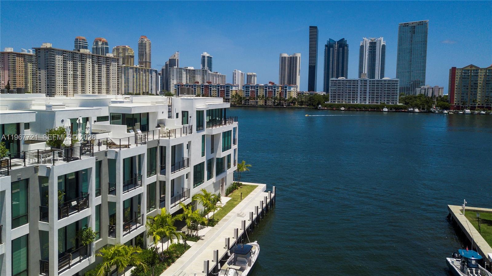 ATTENTION BUYERS: A rare, time sensitive opportunity to secure this exceptional property is now. The unique chance to acquire this caliber of a property comes with an advantage price adjustment of almost 0.5 million off list. 


Welcome Home to Peace and Serenity. Townhouse 6 is located on the Inter-Coastal Waterfront of the 2024 Built, Koya Bay Townhouse Community within the gated Eastern Shores neighborhood. The townhouse is bathed in natural light spread across four stories of living space. The 3500 square feet comprises of 4 bedrooms 4 and a half bathrooms with a private rooftop terrace fully equipped with a summer kitchen, al fresco dining and a plunge pool. The floor-to-ceiling impact glass fully stacking doors effortlessly brings the outside in creating a seamless flow throughout each story. The owner spared no expense, the customized wall paneled Kitchen houses top of the line Wolf and SubZero Appliances and Wine Aficionado's are in for an incredible surprise! Lastly the property is pre-wired with a Smart Home Electronics and Security System easily accessed by a touch pad or app on your phone.