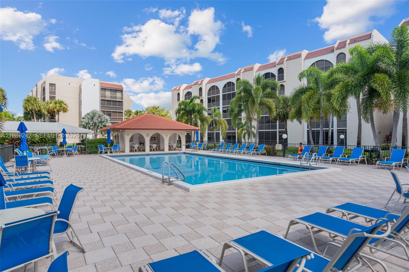 Make this 2-bedroom, 2-bath condo your own in a beautiful, well-maintained 55+ community.  The HOA offers an active community center, a pool, gym and many activities in a lush, tropical setting. Washer and dryer inside the large, screened porch overlooking the golf course.  Lots of green areas to enjoy mother nature while still being close to malls, restaurants and grocery stores.  Maintenance includes cable and water.