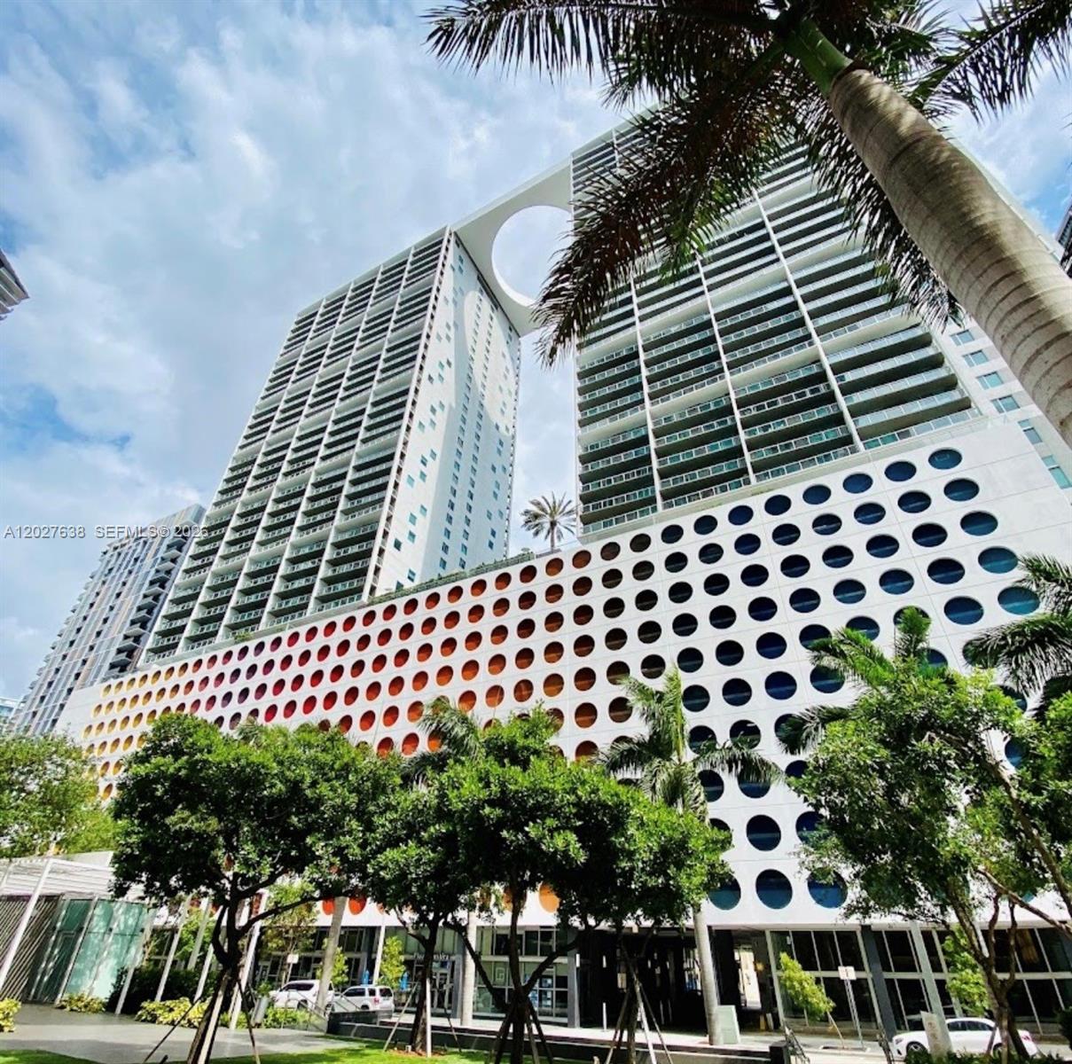 Live elevated in the heart of Brickell at the prestigious 500 Brickell. This exceptional 2BR/2BA Lower Penthouse corner residence on iconic Brickell Avenue showcases breathtaking panoramic water views of Biscayne Bay through dramatic floor-to-ceiling windows and soaring 11-foot ceilings. The spacious split floor plan features a sleek open kitchen with Italian cabinetry, quartz countertops, and premium appliances, along with an oversized primary suite with custom walk-in closets and a spa-inspired bath. Enjoy world-class resort-style amenities, including spectacular 42nd-floor rooftop heated pool with 360-degree views, an 11th-floor pool deck with daybeds, high-tech fitness center, luxury spa with sauna/steam, private theater, wine cellar, and 24-hour concierge, security, and valet. Directly on premier Brickell Avenue, you enjoy an elite lifestyle steps from Brickell City Centre, world-class dining, and the Metromover. A rare opportunity to own a luxury corner penthouse with some of the best views in Brickell.