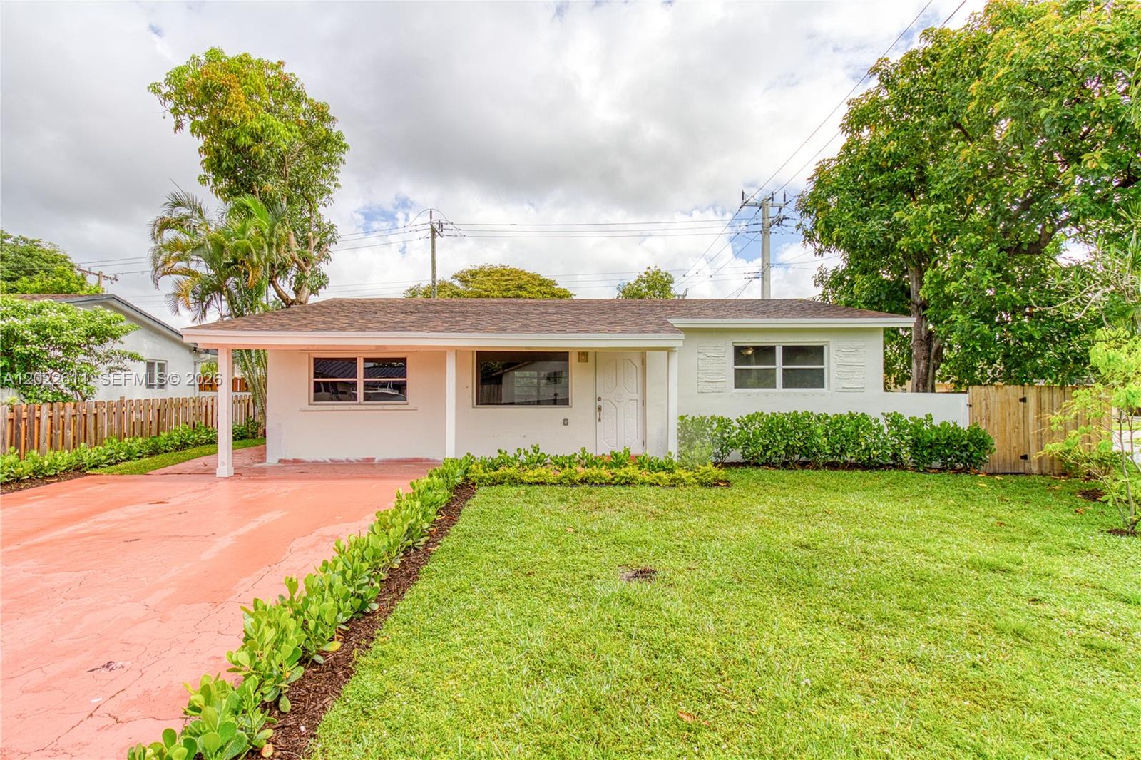 Charming 3-bedroom, 2-bath home situated on a spacious corner lot in central Hollywood. The home maximizes space with an open-concept layout and Florida room and is filled with natural light. Updates include newer roof, fresh landscaping, newly painted interior and ceiling popcorn removal, and a newer AC system. The screened-in patio overlooks the large fenced backyard with plenty of room for a pool. Fantastic central location near shopping, dining, parks, and major expressways. Plenty of parking and the freedom of NO HOA. Move quick on this one!