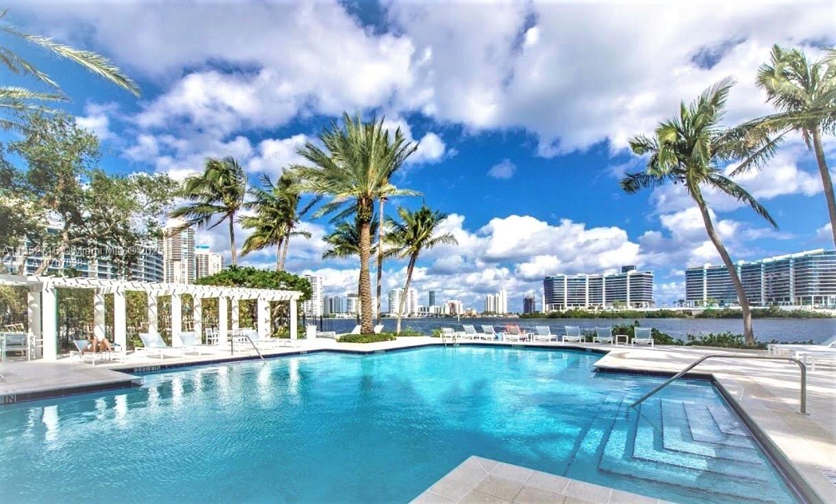 Largest 2/2 floorplan on best building on the Bay. Split bedroom plan with three large walk-in closets and open kitchen. Full size washer and dryer inside. In heart of Aventura Mediterranean style community boasting bayfront heated pool, clubhouse with full gym, 2 lighted tennis tennis courts, second pool with BBQ area and more. Pet friendly community (2 pets ANY size). Can rent 1st year (min 1 month rental period) and water and cable included. Walk to shopping, restaurants, etc. Great A schools (Waterways K-8 & Aventura Charter) as well as Krop Senior and upcoming Charter High. Great for investor. Seller Motivated!!