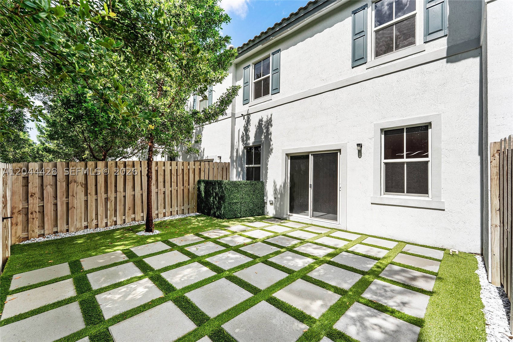 PRICED TO SELL! Offered below market value, this LIKE-NEW 2023-built townhouse has been barely lived in and is move-in ready. The open-concept floor plan is perfect for everyday living and entertaining, flowing seamlessly to a newly installed, maintenance-free backyard oasis—an ideal space to relax or host family and friends, with no rear neighbors. The townhome also features quartz countertops, stainless appliances, 2nd-story laundry, stylish cabinetry and fixtures, and impact windows/sliders. Sunset Trails is a gated community offering a resort-style pool, spa, tot lot, and neighborhood walking trails, all with low HOA fees. Ideally located in an A-Rated school disctrict in the heart of Coral Springs, you'll enjoy convenient access to shopping, restaurants, grocery stores, and major highways. This is an exceptional opportunity to own a nearly new home at an incredible value.