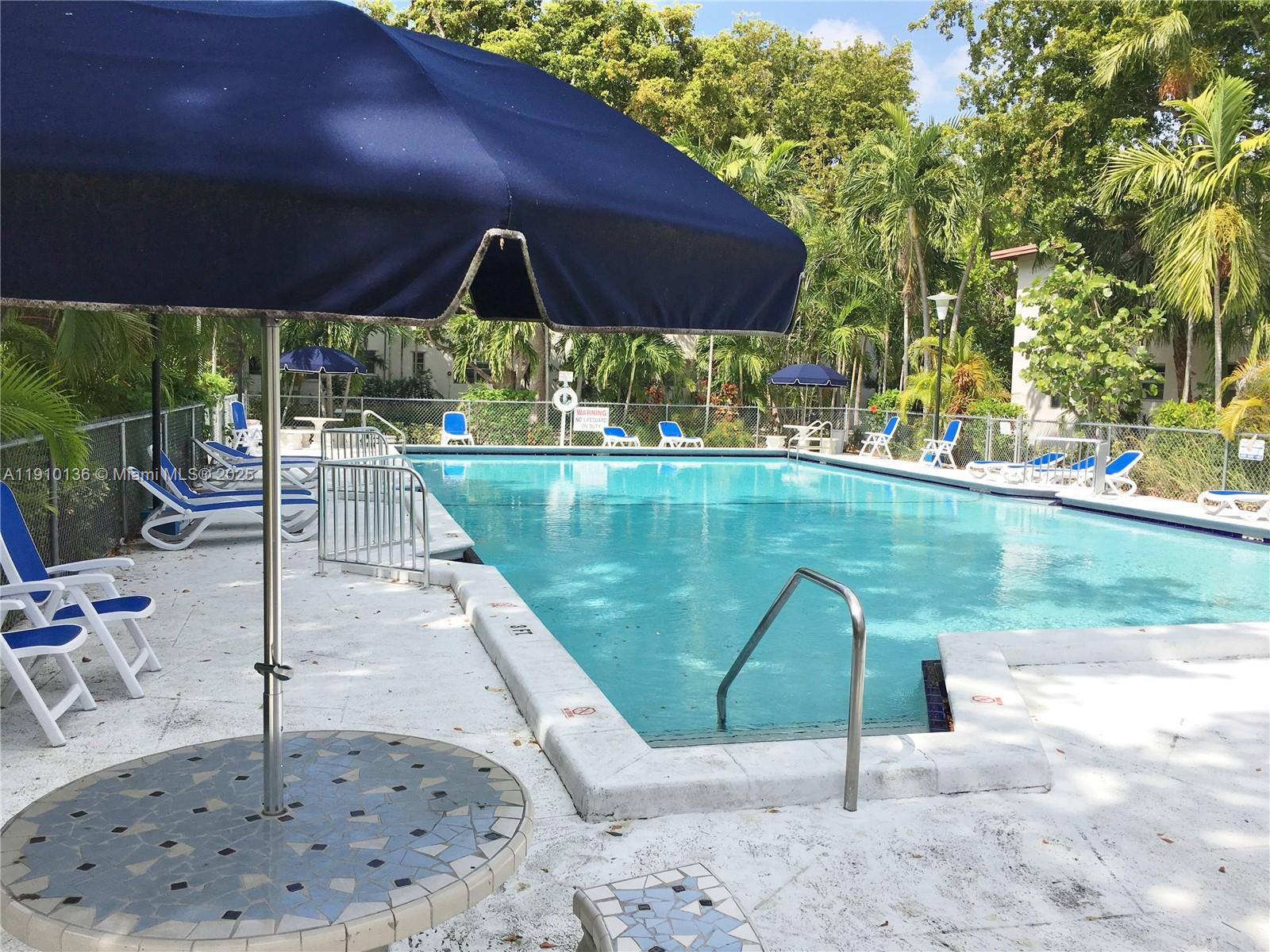 Incredibly lush garden community. This charming apartment just had new floors installed. It is located in High Pines, close to South Miami, within walking distance to the Shops at Sunset Place Mall and restaurants. Impeccably kept residence with wonderful natural light. The community interior is fenced, allowing children to play and enjoy the outdoors. Amenities include a pool, BBQ, onsite management, and wonderful garden areas. No pets, as per Condo Association. Available starting January 1, 2026 (can be available sooner if needed). Sunset Elementary school zone. Windows protected by hurricane accordion shutters.