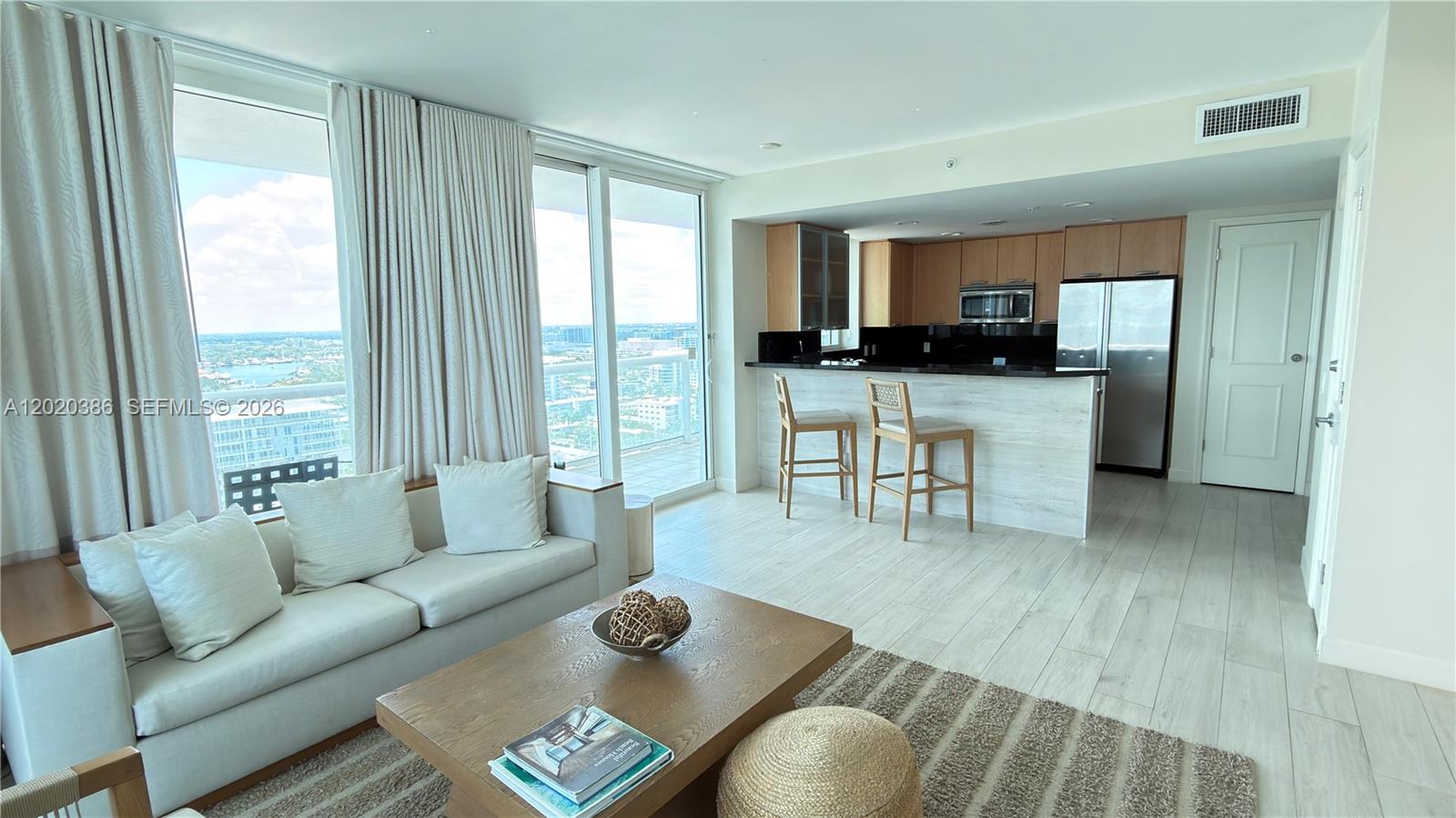 Spectacular corner condo at the prestigious Q Club Resort and Residences offering panoramic ocean, Intracoastal and city views from an oversized wraparound balcony. This fully furnished 2 bedroom, 2 bath features floor to ceiling impact windows, abundant natural light, a fully equipped kitchen with stainless steel appliances, washer and dryer inside the unit, and a spacious living area with pull out sofa for additional guests. The split bedroom layout offers privacy, including a lockout suite ideal for personal use or flexible rental options. Enjoy resort style living with world class amenities including tropical pool deck with private cabanas, full-service spa, fitness center, concierge, valet, restaurants, room service, business center, roof top, and more. Located directly across from the beach and just minutes from Las Olas, fine dining, shopping, nightlife and Fort Lauderdale Airport. Optional Hilton rental program available, making this an exceptional vacation home, second residence or income-producing investment opportunity.