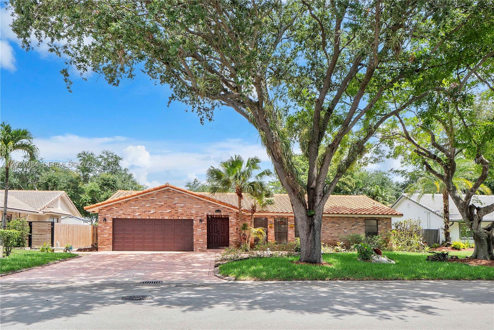 A MUST SEE! NO HOA! This beautifully maintained 5-bedroom pool home in the desirable Cypress Glen community offers the perfect blend of comfort, upgrades, and the indoor/outdoor South Florida lifestyle buyers love. From the moment you arrive, you’ll notice the pride of ownership showcased by the widened stamped concrete driveway, updated landscaping, and inviting curb appeal. Inside, the home features spacious living areas, updated flooring, refreshed bathrooms, and a beautifully updated kitchen complete with under-cabinet lighting, newer appliances, and a hurricane-impact pass-through kitchen window to the patio/pool area perfect for indoor/outdoor entertaining. The primary suite creates a relaxing retreat with a spa-inspired bathroom featuring a whirlpool tub, ceiling shower, and dual closets. Step outside and enjoy your own private backyard oasis with a screened pool enclosure, pool safety gate, new sod, updated sprinkler system, wood fencing, and plenty of space to relax and entertain. This home also offers peace of mind with major upgrades already completed, including a newer upgraded two-stage 4-ton Trane A/C system, additional hurricane-impact windows and doors, hurricane-rated front and garage doors, updated electrical safety features, newer water heater, and more. Rear fence access toward Atlantic Blvd adds additional convenience to this move-in-ready Coral Springs home.