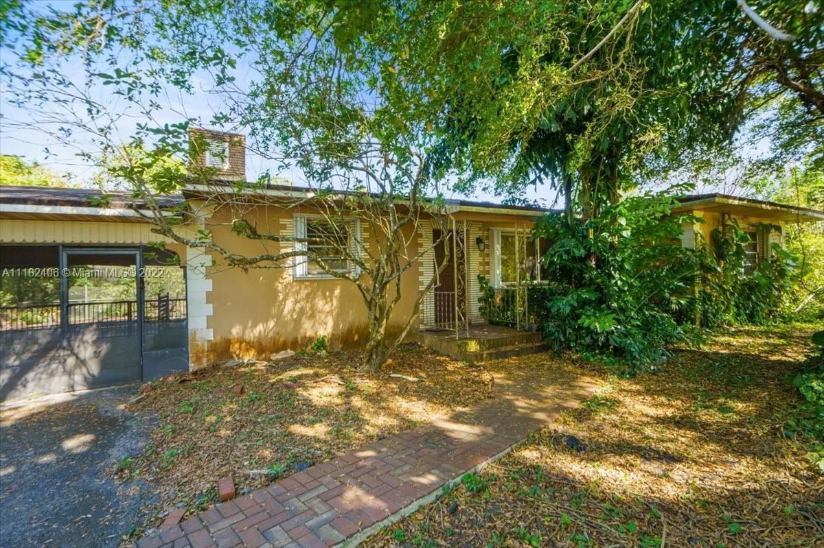 2.5 acres in the heart of the Redlands, handyman special or investor opportunity.  The main house has 2 bedrooms, 1 bathroom, with 1 bedroom/ 1 bathroom cottage separated by a breezeway which overlooks the pool.  The home is located adjacent to the Hattie Bauer Hammock Preserve, and surrounded by tree farms nursery’s and large, beautiful homes.  There is one well on the property.  Agricultural exemption.  Build your mansion or tree farm/nursery business for great income and future.  Property sold AS-IS, CASH ONLY contracts.