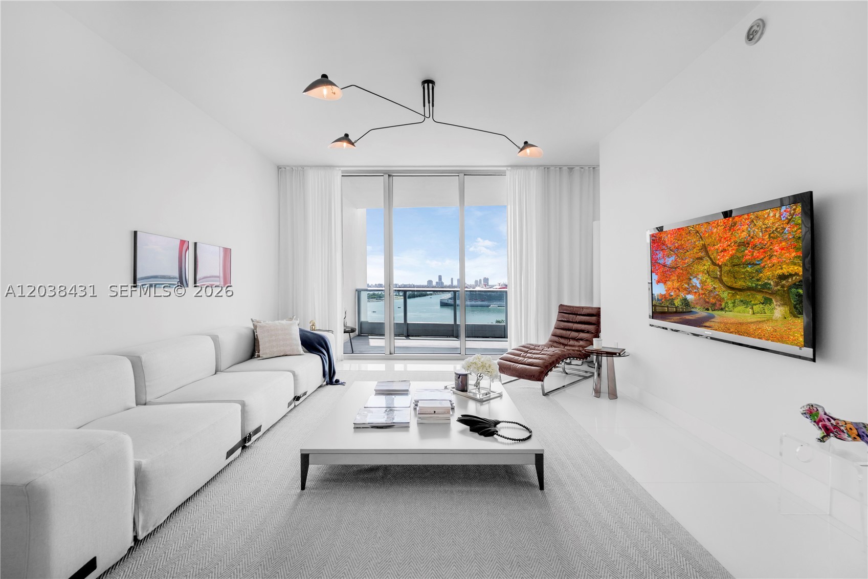 Experience elevated luxury living at 900 Biscayne Boulevard, one of Downtown Miami’s most iconic addresses. This spectacular 3-bedroom, 3-bath residence offers breathtaking panoramic views of Biscayne Bay, the Atlantic Ocean, and the Miami skyline through dramatic floor-to-ceiling glass windows that fill the home with natural light.

Elegantly finished with Crystal White marble flooring throughout, the residence features a spacious open-concept design that seamlessly connects the living, dining, and kitchen areas, creating the perfect setting for both everyday living and entertaining. A large private terrace invites you to enjoy stunning sunrises, sparkling city lights, and Miami’s year-round waterfront lifestyle.

The gourmet kitchen is appointed with premium stainless-steel appliances, custom cabinetry, stone countertops, and refined designer finishes. The luxurious primary suite showcases spectacular bay views, generous closet space, and a spa-inspired bathroom with dual vanities, soaking tub, and separate glass-enclosed shower.

A truly unique feature of this residence is that each bedroom enjoys direct access to its own private terrace, offering exceptional privacy, outdoor living, and breathtaking views from every room.

Residents of 900 Biscayne enjoy world-class amenities including 24-hour concierge and valet, resort-style pools, state-of-the-art fitness center, spa, theater room, club lounge, business center, and more. Ideally located steps from Bayfront Park, Kaseya Center, Miami Worldcenter, museums, fine dining, and luxury shopping, this exceptional residence offers the ultimate Miami luxury lifestyle in the heart of the city.