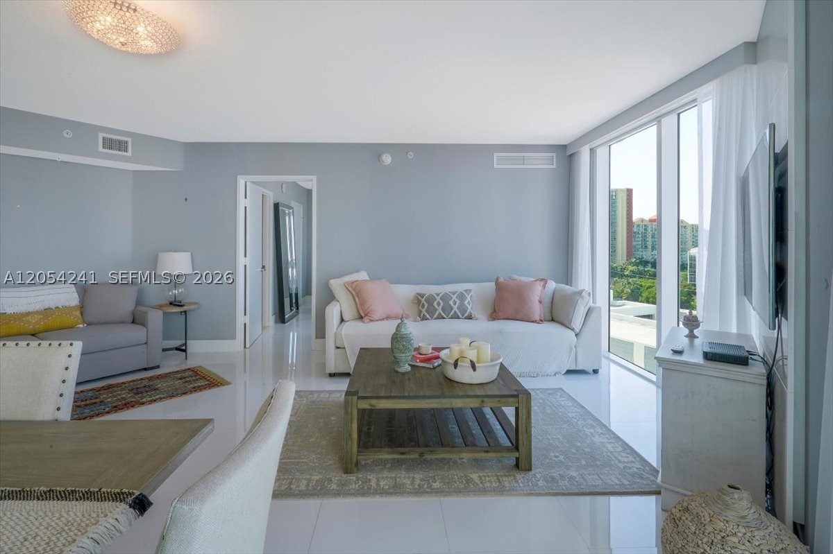 Don’t miss this stunning 3BR/2BA gem situated in an unbeatable location minutes from the beach. Bathed in natural light, the home offers a seamless open-plan layout that connects the modern kitchen—featuring stainless steel appliances—directly to the living and dining areas. The smart split-bedroom floor plan ensures maximum privacy, highlighting a large master retreat with an ensuite bath. Building Perks: Sparkling Pool & Fitness Center, Assigned Parking Space.