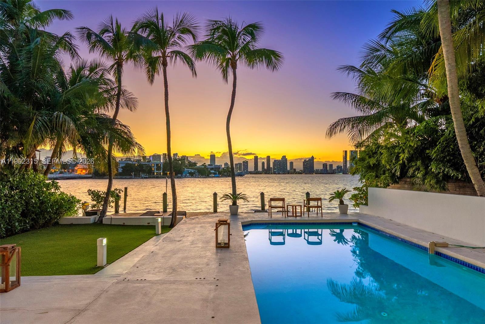 Waterfront oasis with western exposure offering striking views of the Miami skyline, wide open bay, and incredible sunsets year-round! Experience waterfront living from the scenic Venetian Islands, sited between the best of both worlds - Miami Beach, and the exciting urban vibes of Miami. Beautifully renovated home with open floor plan connecting the living room, dining area, and Boffi kitchen. Family room, full bath, and a large workspace/office complete the first floor. Upstairs, 3 bedrooms, including a master suite with a sitting area and large terrace. The backyard is equipped with a covered patio, pool, lounge areas. This lushly landscaped property has 60-FT of waterfront with a dock– ideal for boaters. Equipped with 2-car, A/C garage, driveway, walled and gated.