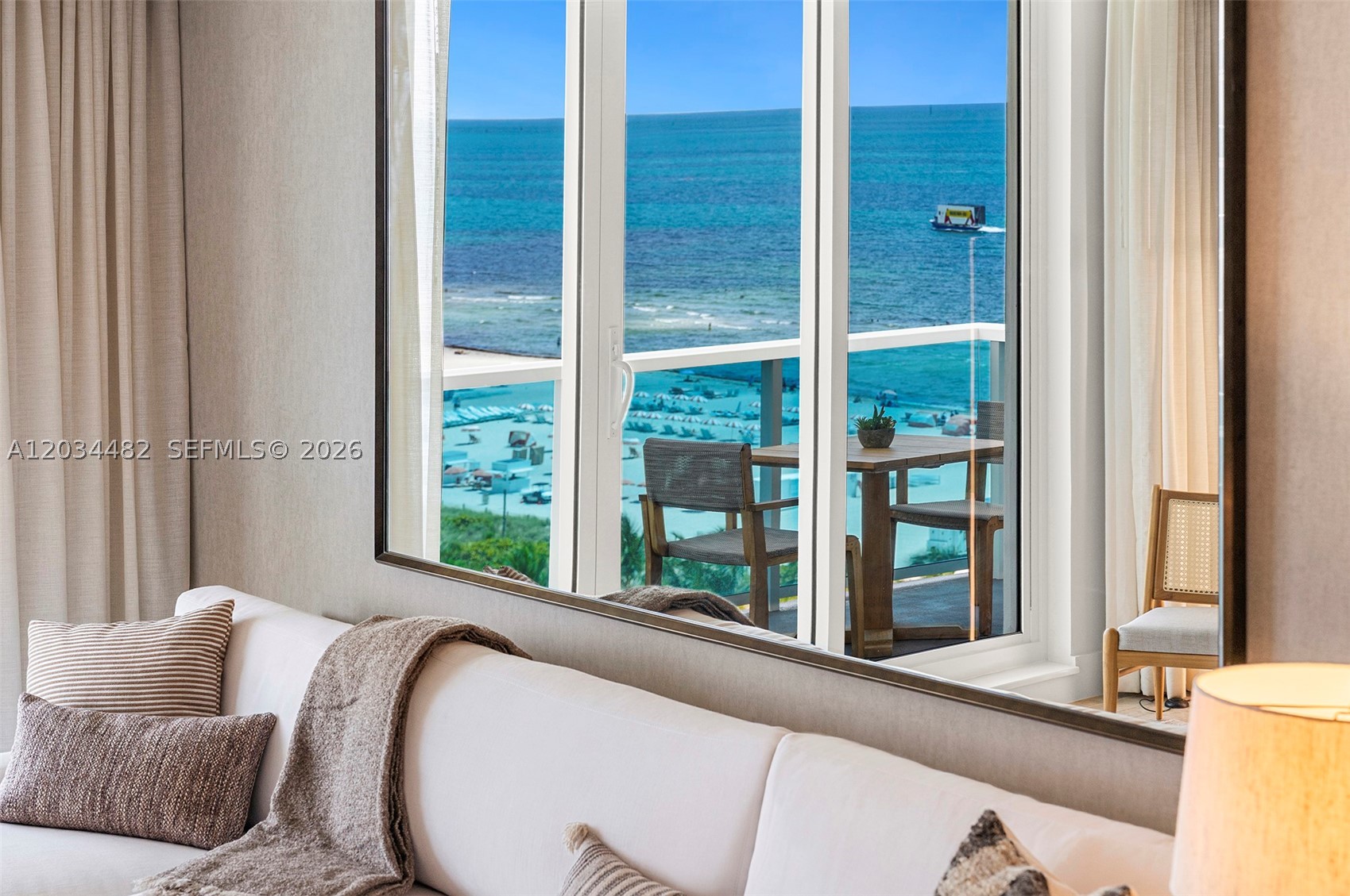 A stylish one-bedroom ocean-view retreat featuring a private balcony, bright open living spaces, and sweeping views of the Atlantic Ocean and resort pool deck.