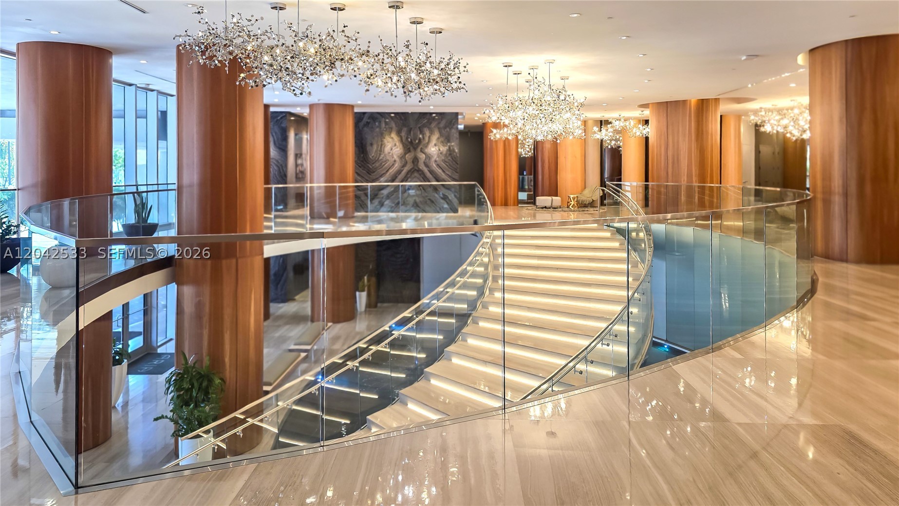Experience elevated waterfront living in this stunning 3-bedroom, 3.5-bath residence featuring a private elevator entry and foyer. Positioned to capture breathtaking 180-degree views of Biscayne Bay, the Port of Miami, the Venetian Causeway, and the Miami skyline, this exceptional home offers one of the largest usable balconies in the building—a true outdoor living space designed for year-round enjoyment. Every living area opens directly to the balcony, allowing spectacular water views from sunrise to sunset throughout the home.
Beautifully upgraded, the residence features Calacatta flooring, Italian cabinetry, quartz countertops, Bosch stainless-steel appliances, custom designer lighting, automated window treatments, and custom California Closets. Floor-to-ceiling glass fills the interiors with natural light.
Residents enjoy resort-style amenities including dual infinity pools, a state-of-the-art fitness center, spa, sauna, steam room, hot tub, BBQ terrace, theater room, resident lounge, business center, and valet service.
Ideally located in the heart of Edgewater, directly across from Margaret Pace Park and just moments from dining, shopping, Biscayne Boulevard, Midtown, Wynwood, the Design District, the Adrienne Arsht Center.
A rare opportunity to own one of Aria on the Bay’s most desirable residences, offering exceptional views, expansive outdoor space, and luxury finishes in one of Miami’s premier waterfront communities.