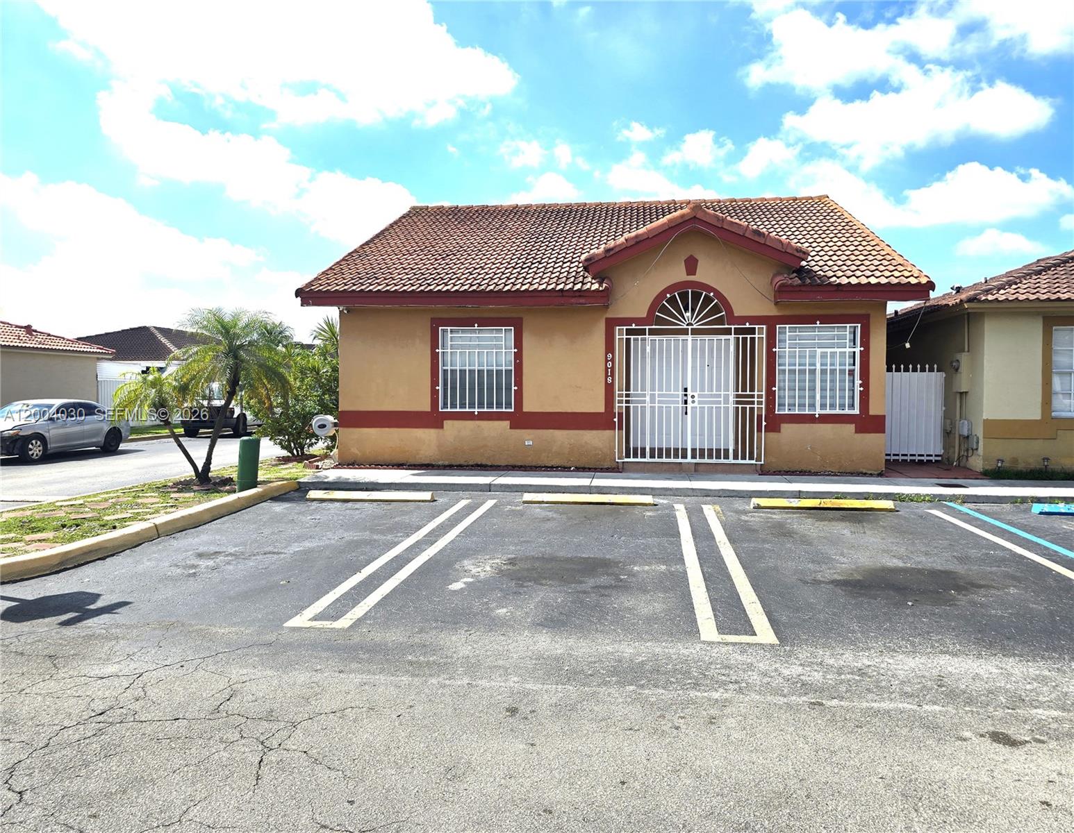 SEE BROKER REMARK....Welcome to this spacious and versatile residence in the heart of Hialeah Gardens! This well-maintained corner-unit home offers the perfect blend of comfort and functionality. Featuring tile flooring throughout, stainless still appliances, washer and dryer inside, 3 parking space, low home owner asssociation (HOA) only 255 per month including structural and roof insurance.Originally designed as a 3-bedroom 2 bath layout, this home includes an enclosed dent that has been thoughtfully converted into a 4th bedroom with closet perfect for a growing family, home office, or guest space. The terrace is ideal for entertaining, relaxing, or creating your own private retreat. As a desirable corner unit, with lateral entry the property enjoys added privacy and natural light, enhancing the overall living experience. Walking distance to the home you have a complex of modern schools that included Elementary, midle and hight school with create estability for you and your family .A fantastic opportunity for homeowners or investors as wells because rent is very hot in the area—schedule your showing . You feel you are wasting money in rent call  and say hello to that pain, never rent again.