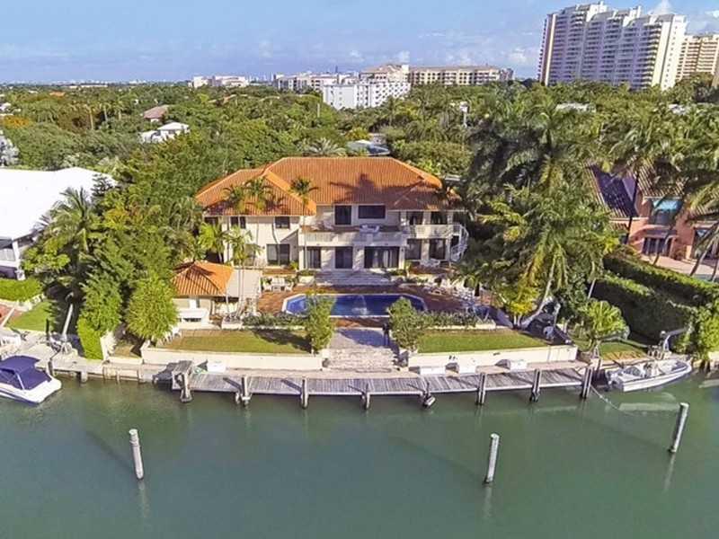 Best opportunity to update a fantastic 2 story home w/ high ceilings on the widest canal in Key Biscayne. Absolute private wide water frontage facing a nature preserve. 148' of deep water frontage perfect for a large yacht. 8 grand bedrooms, 8 full/2 half  baths. Formal dining, living & family rooms add to the inviting atmosphere of entertainment providing large & spacious living areas. Staff quarters, 2 car, garage, sauna, steam room, BBQ, large patio & outdoor bar facing gorgeous tropical pool & gardens.