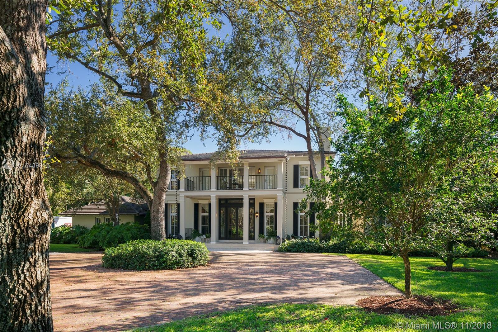 Plantation style estate on over an acre with storybook setting perfect for entertaining!  Gated entry with circular driveway, vaulted ceiling foyer entry to formal dining/living rooms.  Family room with custom built in and wood bar.  Beautiful custom kitchen with SS appliances, walk in pantry and chef’s island.  Ground floor master bedroom with sitting room/office. 4 bedrooms & second family room upstairs with balconies overlooking the picture perfect grounds. Expansive backyard with stone floors, lit basketball court, pool, and cabana bath.  Includes 2 car garage, impact glass, wood floors throughout handcrafted custom millwork and Lutron lighting.