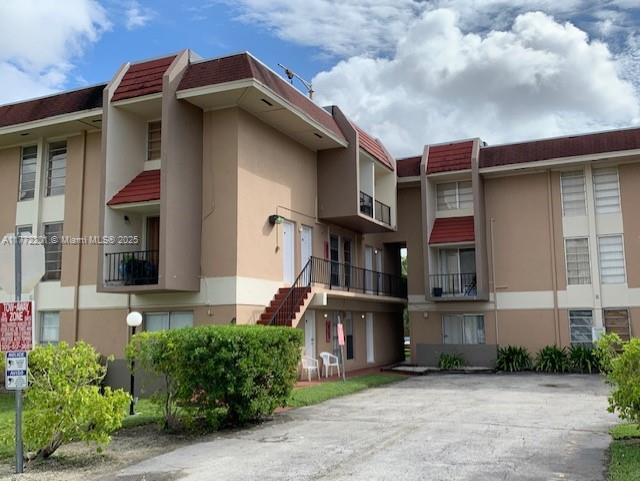 Large two story 1 bedroom 1 bathroom apartment centrally located close to Bird Road- This unit is located on the 2nd floor(No elevator). The unit's layout is townhome style, kitchen has granite counter tops, range-e, refrigerator, and microwave. The Kitchen, living and dining room are in the first floor and bedroom and bathroom on the second floor. Convenient laundry room in the building, community pool and assigned parking space with plenty of visitors spaces. Tile throughout in the second floor, and brand new wood floors in the first floor.