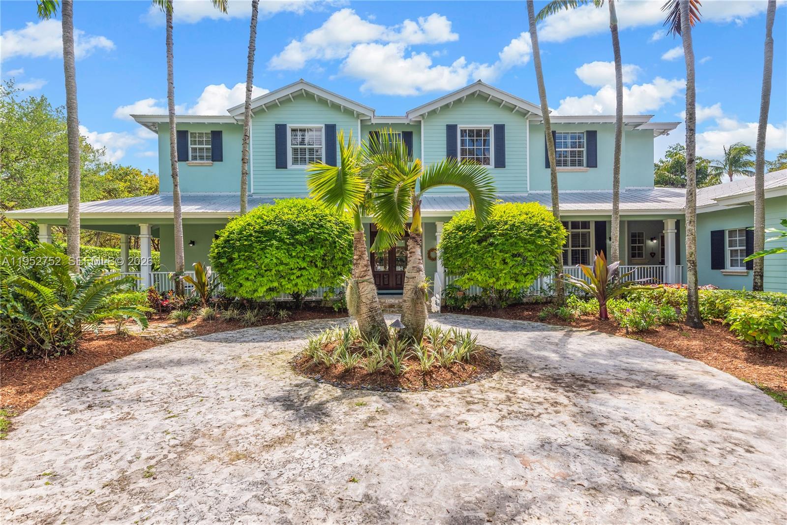 Located in the heart of Pinecrest on a picturesque 45,738 SF lot, this 7,763 SF Key West style home is a true sanctuary! Built in 2007, it features a spectacular & deep wrap-around porch that serves as outdoor living space, including a summer kitchen overlooking the resort-style pool. The welcoming floorplan has a double-height foyer entry w/ sweeping staircase, formal liv & din rms, office, chef’s kitchen w/ eat-in area, & spacious family room. Located on the 2nd floor, the primary suite has a private balcony, 2 walk-in closets, & a large bathroom including dual sinks, separate tub & shower, + vanity area. There are 6 add’l BRs & 5.5 more BA’s as well. With a 3 car gar, impact glass, generator, coffered ceilings, laundry room, & much more, this is the perfect place to call home!