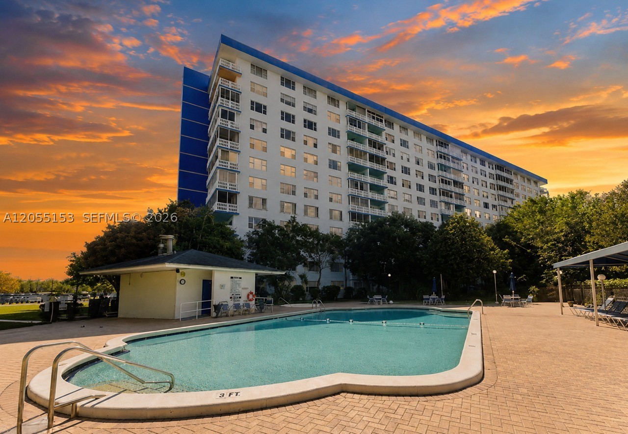 Welcome to this spacious and bright 1-bedroom, 1.5-bath condominium located in the highly desirable 55+ Hillcrest community. Freshly painted and featuring beautiful ceramic tile flooring throughout,  this well-maintained residence offers an open and inviting layout filled with natural light, along with a beautiful pool view from a large enclosed balcony that creates a peaceful setting. Enjoy resort-style amenities with maintenance that includes 24/7 security, a heated pool and hot tub, newly renovated tennis courts, extra storage, cable TV, water, trash removal, pest control, and a deeded parking space. 
Ideally situated in the heart of Hollywood, Hillcrest offers easy access to shopping, dining, beautiful beaches and major highways. Whether you're looking for a year-round residence or a seasonal retreat, this move-in-ready condo offers comfort, convenience, and an exceptional South Florida lifestyle.