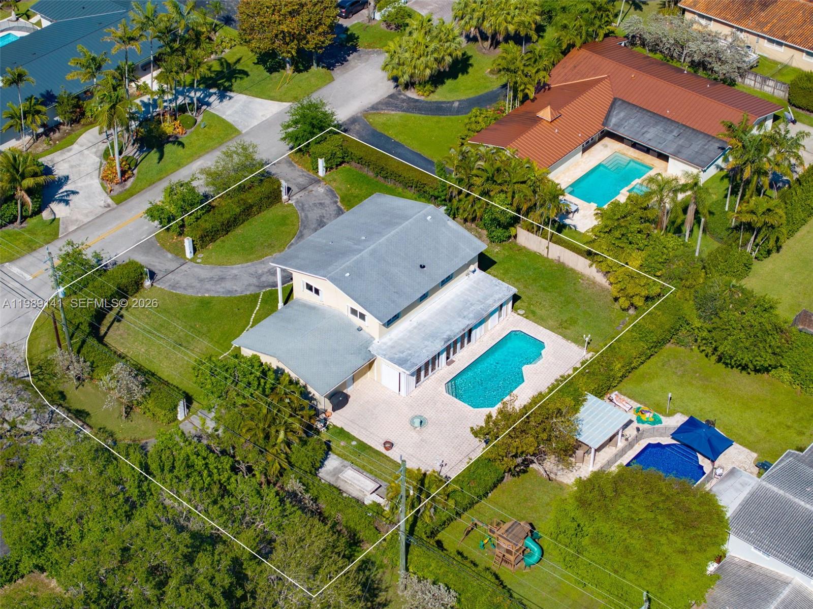 Set on an expansive 15,000 SF lot, this two-story home offers a rare combination of space and potential. The oversized backyard features a sparkling pool and ample room for outdoor living, entertaining, or future expansion. With 5 bedrooms, 3 bathrooms, and a large circular driveway with plenty of parking, this property presents an excellent investment opportunity or renovation project in a highly desirable setting.