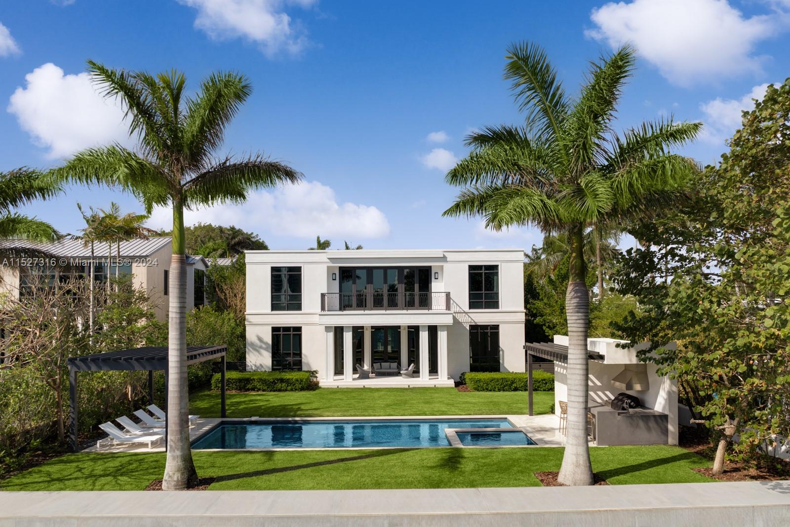 Located on guard-gated Allison Island, this Max Strang designed home was completed at the beginning of 2022. Sitting on a 16,200 SF lot, this 7,000 SF home boasts six bedrooms and nine bathrooms. The oversized primary suite, facing the Indian Creek waterway, has two separate closets and bathrooms. Custom kitchen cabinetry by Boffi, appliances by Wolf and Sub-Zero, this Smart home is powered by Savant. Shellstone and white oak flooring throughout are complemented by built-in, custom cabinetry. Interior design by Artefacto. Enjoy true outdoor living in your large backyard oasis with a full summer kitchen and heated salt water swimming pool. Home also has a whole-house generator. 75 FT on the water offers the ability to dock your yacht at home.