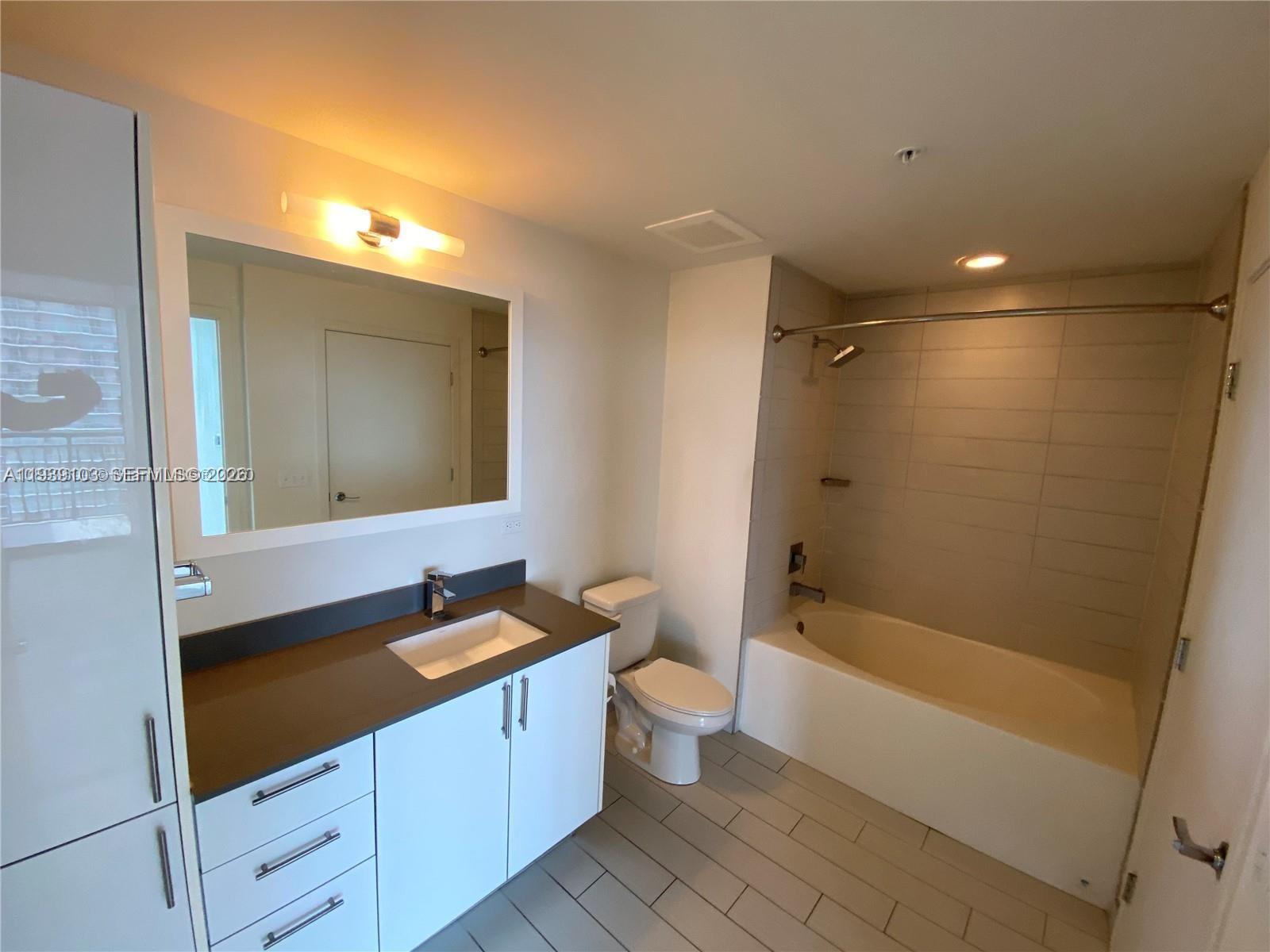 Spacious corner unit with beautiful water and city views from ideal 27th floor. Largest 1 bedroom + den apt facing East with 180 degree views and double size balcony. Best selling floorplan at NINE, on top of Mary Brickell Village, in the center of it all, the heart of this fantastic neighborhood, just an elevator away from shopping, restaurants, supermarket, movie theater, Brickell City Center, and many more. Unit is finished with porcelain tiled floors throughout, as well as the balcony; quartz countertops, window treatments, full washer and dryer, and excellent assigned parking space for self parking if desired. 
Tenant occupied until 1/19/2027 paying $3,300 per month