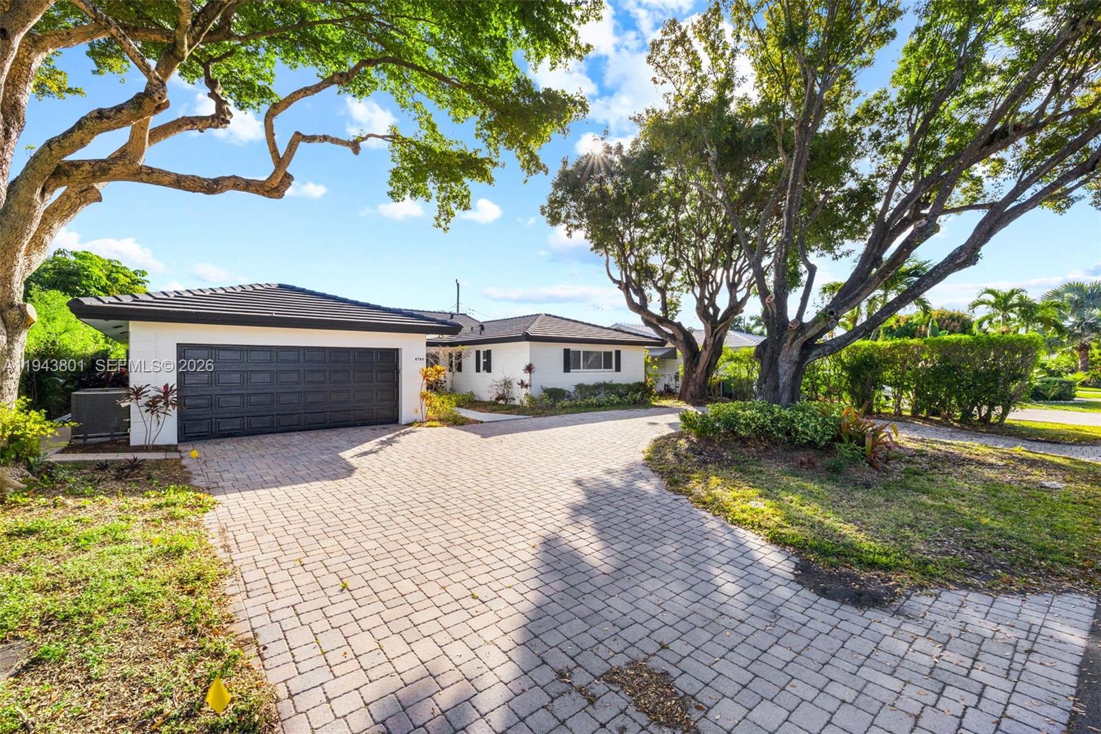 PRICE IMPROVEMENT! Welcome to Coral Ridge Estate, one of Fort Lauderdale’s most desirable communities. Close to the beach and Bayview Park, with close proximity to top private schools, Coral Ridge Country Club golf, dining, shopping, and entertainment. The home is move-in ready with a beautiful yard that features a pool and artificial turf. Large driveway with lush landscaping. 4/3.5 per tax roll but previous owner combined 2 bedrooms into 1 large master bed/bath/closet. Current floor plan is a 3/3.5. This is a bank owned property and only electric service will be ON. Water is NOT and will NOT be on at any time even for inspections so please be aware of this before making an offer. BUYER MUST ASSUME OPEN PERMITS. The process of closing the open permits is simple as there was never a contractor attached to the permits and no work ever started. Seller will not close the open permits prior to closing as the city of Fort Lauderdale requires the owner of record to be registered in Florida to sign the necessary forms and the seller is an out of state LLC. Please see broker's remarks for more information on how to submit offers.