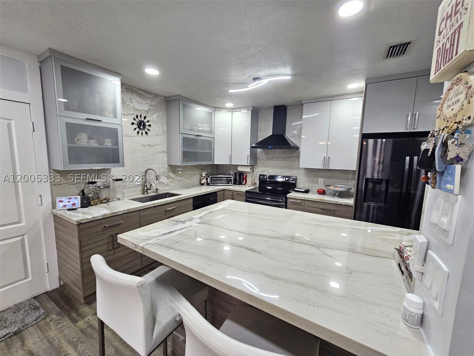 SELLER WILL CONTRIBUTE UP TO $5,000 TOWARD THE BUYER'S CLOSING COSTS WITH A FULL-PRICE OFFER. Amazing 3-bedroom, 3-bathroom home with a 2-car garage, NO HOA, and located in a no-flood zone. Completely remodeled, this move-in-ready property offers modern comfort and stylish upgrades throughout. The stunning kitchen features updated cabinetry, sleek countertops, and stainless steel appliances, flowing seamlessly into the spacious living and dining areas. Each bathroom has been tastefully renovated with contemporary fixtures and elegant finishes. The generous primary suite provides comfort and privacy, while the additional bedrooms offer flexibility for family, guests, or a home office. Situated in a desirable neighborhood close to shopping, supermarkets, great schools, and major roadways. Conveniently located near public transportation, West Kendall Baptist Hospital, restaurants, and much more. A true turnkey opportunity ready for its new owner.