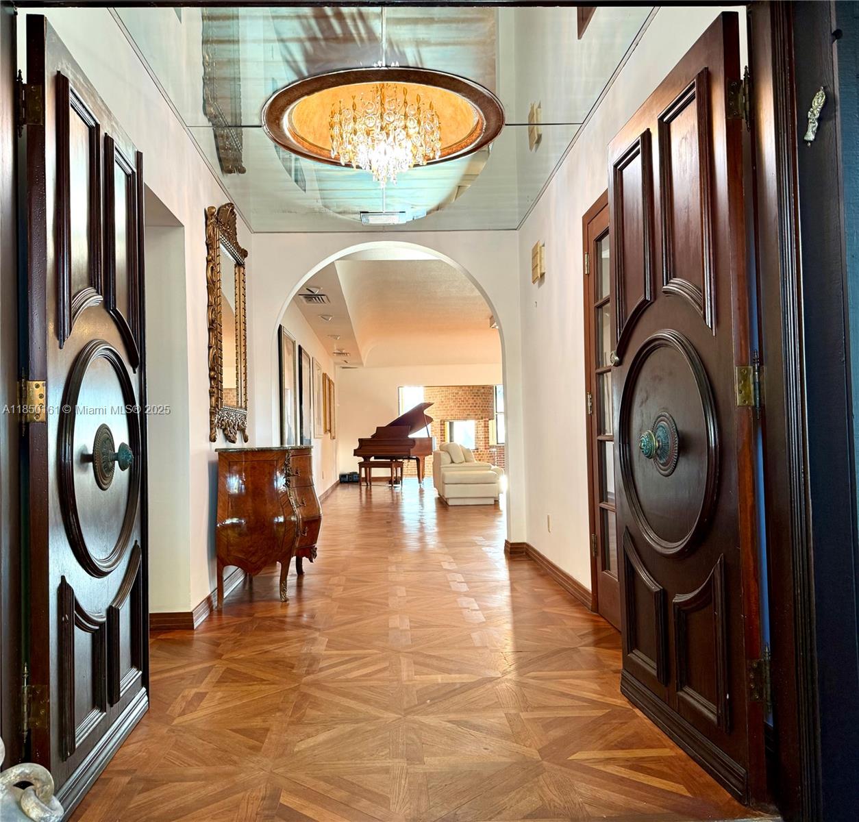 Step into endless possibilities: build 1 palatial estate, possibly build 2 homes, or reimagine the existing. Welcome to the Gated Community of SANS SOUCI ESTATES. A True boater's paradise with Ocean Access in Minutes. This rare estate spans 2 lots with ~18,000 SF, 150’ of Waterfront, up to 11' Ceilings & Seller Reports Over 8,200 SF of Interiors. 6 Bedrooms, including Staff Suite w/ separate entrance. A Compound with Rooms to Match Every Mood : Vintage Arcade, a Sun-Filled Loft, Office, a Palatial primary suite & bathroom Spa with Sauna, Steam Room & Soaking Tub, expansive living room & Old-World Dining Room. This Estate is Primed for Renovation or Redevelopment. See inspirational renderings.