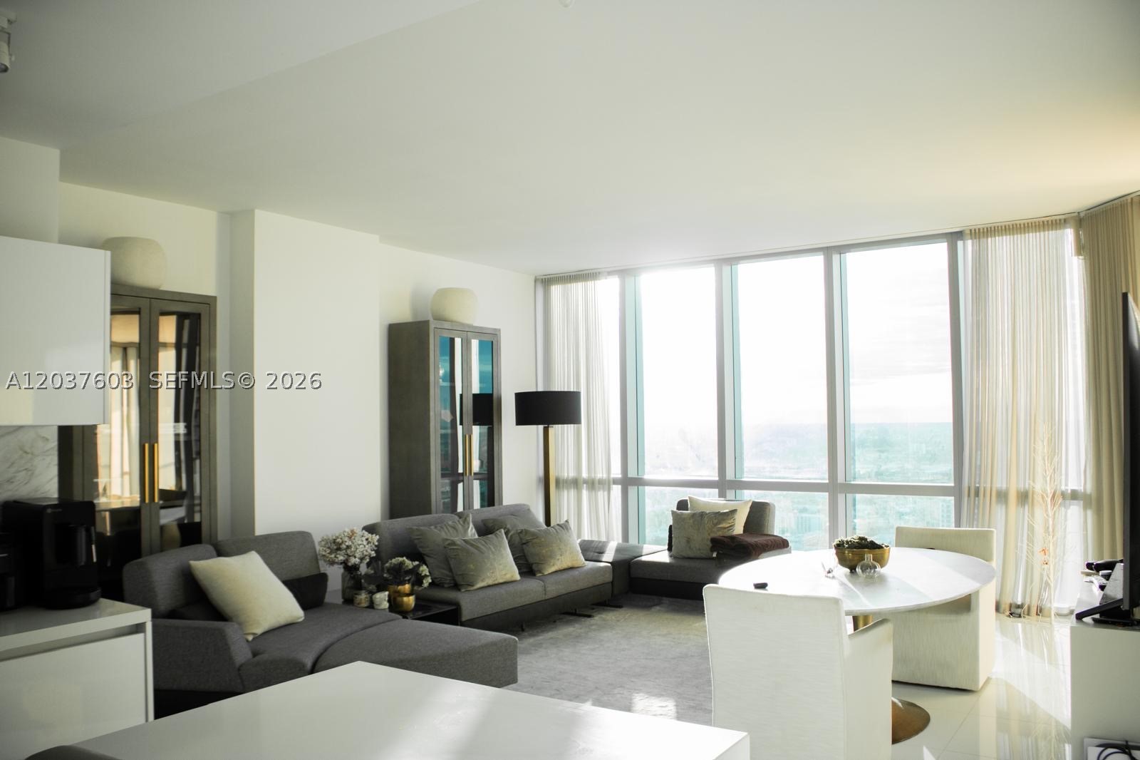 Welcome to Residence 4806 at Paramount Miami Worldcenter. This stunning 1 Bedroom + Den residence offers 1,359 SQFT of luxury living with a private elevator entry and exclusive foyer for added privacy and convenience. The spacious layout is tastefully furnished with high quality furnishings and features floor to ceiling windows showcasing breathtaking sunset and city skyline views. Filled with natural light, this residence offers the perfect blend of comfort and sophistication. The versatile den is ideal for a home office, guest space, or additional living area. Residents enjoy access to Paramount’s world class amenities, including resort style pools, spa, fitness center, basketball court, tennis courts, soccer field, boxing studio, sky lounge, and more. Located in the heart of Downtown Miami, just seconds from shopping, dining, entertainment, and major transportation. Includes one assigned parking space and one valet parking space. Experience elevated living in one of Miami’s most luxury towers.