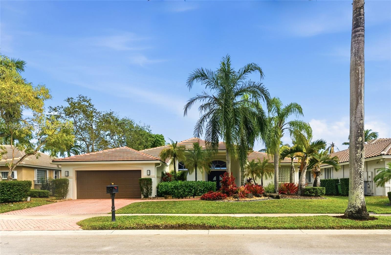 Wake up to breathtaking lake views in this 4 bedroom plus office, 3 full bath custom one story situated on an oversized 11,877 sq ft lot in the gated community of Weston Hills. NEW ROOF 2023, NEW MODERN KITCHEN 2023 w/quartz countertops, Thermador appliances. 3,037 sq ft under air,  soaring ceilings, marble flooring in the main living areas, fully fenced backyard, resort style pool with NEW Diamond Brite finish, NEW travertine pool deck 2025.  freshly painted exterior, accordion shutters, lush tropical landscaping, move in ready.
Check attachment for list of upgrades.