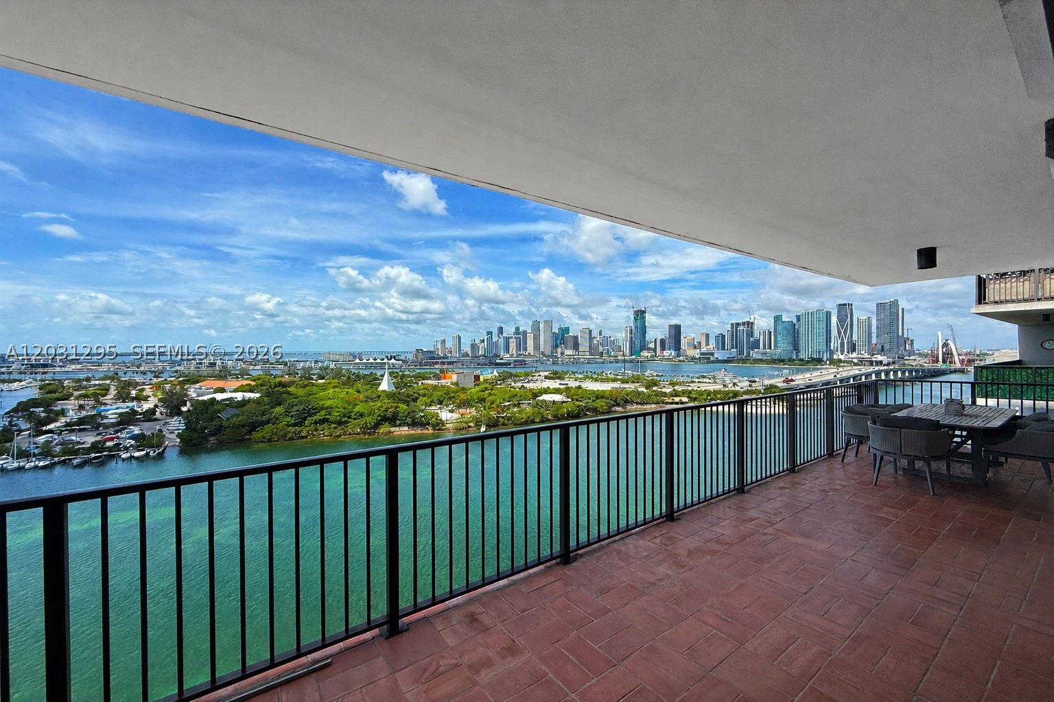 Experience waterfront living at 1000 Venetian Way 1703, a beautifully updated 3-bedroom, 2.5-bathroom residence offering 2,010 square feet with breathtaking sunrise and sunset views of Biscayne Bay, the Miami skyline, and Miami Beach. This desirable flow-through floor plan features two expansive private terraces, floor-to-ceiling windows, porcelain tile flooring, and abundant natural light throughout. All bedrooms, the living areas, and kitchen open directly onto the terraces, creating seamless indoor-outdoor living. Additional features include electric hurricane shutters, a semi-private two-elevator foyer shared with only one neighboring residence, and two assigned parking spaces. Residents enjoy exceptional amenities including two waterfront pools, a state-of-the-art fitness center, luxury spa with Turkish steam rooms, tennis and basketball courts, a children's play area, dog park, private club room, business center, concierge, and 24-hour security. Ideally located on the Venetian Causeway, just minutes from Downtown Miami, Sunset Harbour, Lincoln Road, and Miami Beach.