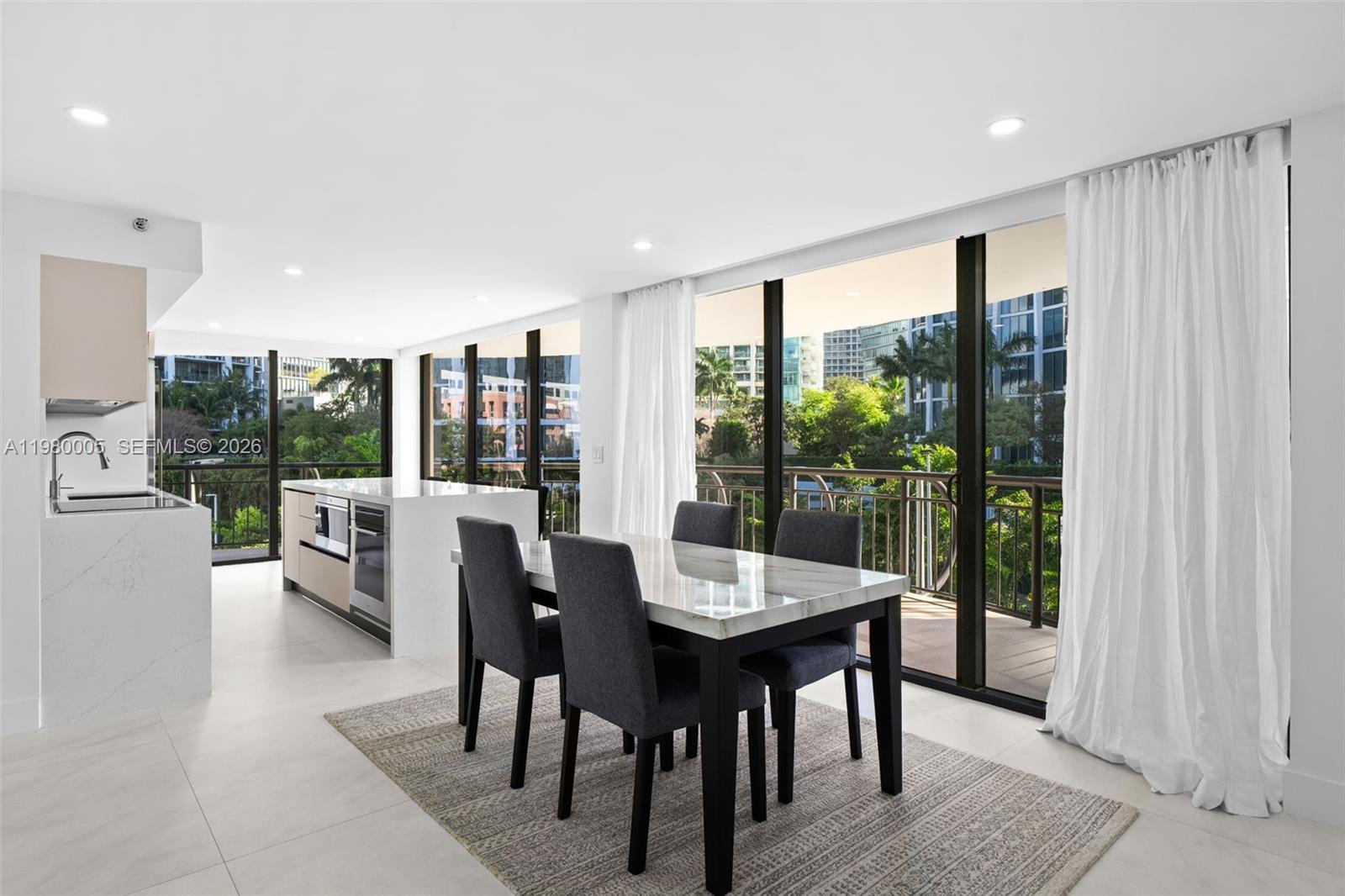 Beautifully renovated 3BD/3BA residence in Grove Towers featuring abundant natural light and a sleek, modern interior. The generous primary suite includes dual sinks, a shower, and a walk-in closet with built-ins, while all other bedrooms have terrace access, creating a seamless indoor-outdoor flow. The kitchen is equipped with an island and top-of-the-line Wolf and Sub-Zero appliances, perfect for entertaining. Enjoy peaceful views overlooking the tennis courts with partial views of Biscayne Bay, along with access to resort-style amenities including a heated pool, hot tub, fitness center, and tennis and pickleball courts. Includes 1 assigned parking space and storage.