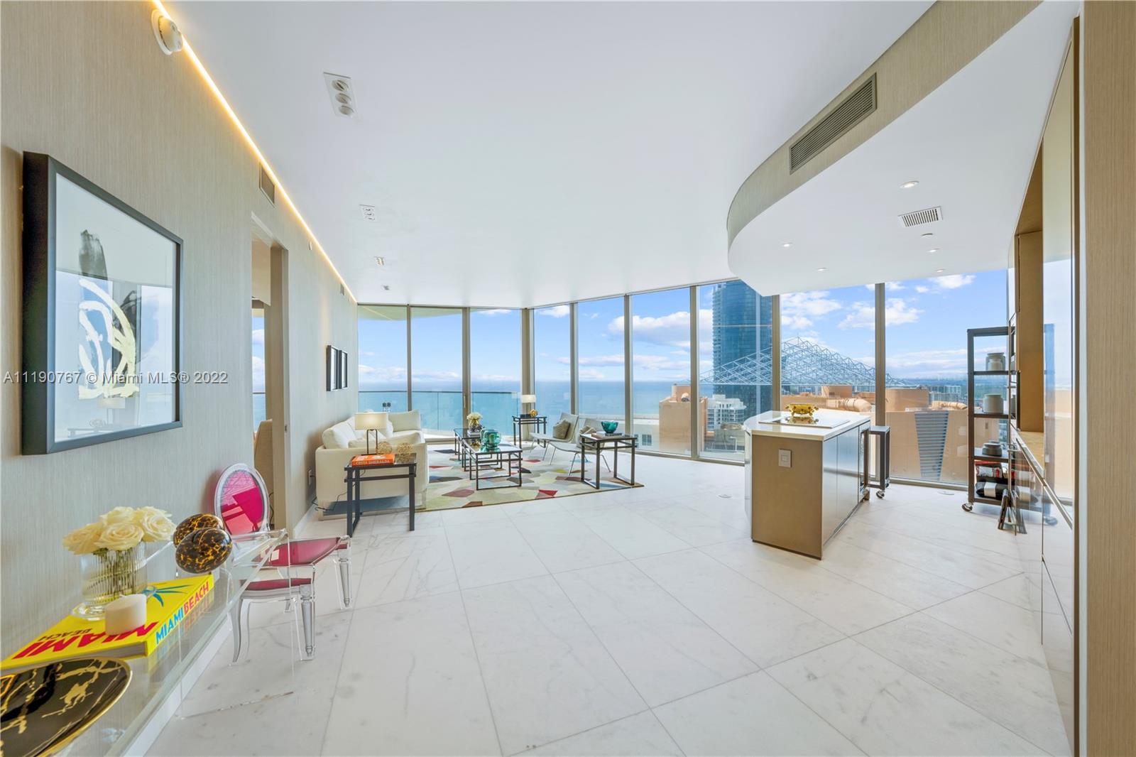 Turnkey 2 bedrooms + 2.5 bath + den corner unit with breathtaking unobstructed ocean views from every room (den is being used as a formal dining). White matte marble flooring thru-out, automatic blackout in both rooms & shades in living area; Exquisite wallpaper thru-out; Italian custom-made closets & mirrors; High-end custom designed ceiling lights; European furniture custom made. Modern kitchen & baths with European style cabinetry, stone counter tops with island & top of the line appliances: Wolf ovens & espresso maker, Subzero Refrigerator & wine cooler. Large terraces with summer kitchen. Exclusive amenities including: Restaurant, Oceanfront resort pool + bar, State-of-the-art fitness center & Spa, children’s play area, direct beach access with beach service, movie theater.