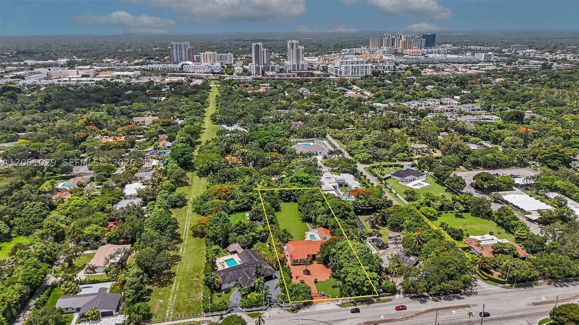 Presenting a once-in-a-generation 1.08-acre gated estate parcel on prestigious Sunset Drive! One of the last acre-plus offerings remaining in central Miami. Measuring an impressive 389.11 feet X 123.09 Feet and zoned EU-1 for estate use, the property features generous frontage and mature perimeter landscaping that affords exceptional privacy, providing an ideal setting for a landmark custom residence encompassing expansive indoor-outdoor living spaces, a resort-style pool, guest house, sport court, and grounds unattainable on a standard lot. The absence of an HOA affords the future owner complete design flexibility. The existing 5BR/4.5BA residence, complemented by a private in-law suite, offers immediate versatility- allowing the buyer to occupy or lease the property throughout the design and permitting process. Ideally situated, the property offers convenient proximity to Dadeland, Downtown South Miami, Coral Gables, and the University of Miami, along with quick access to US-1 and SR-826. Premium pricing on surrounding new construction further reinforces this parcel's highest-and-best-use potential. Opportunities of this caliber rarely become available. Prospective buyers are advised to independently verify zoning, permitting, lot dimensions, and building requirements.