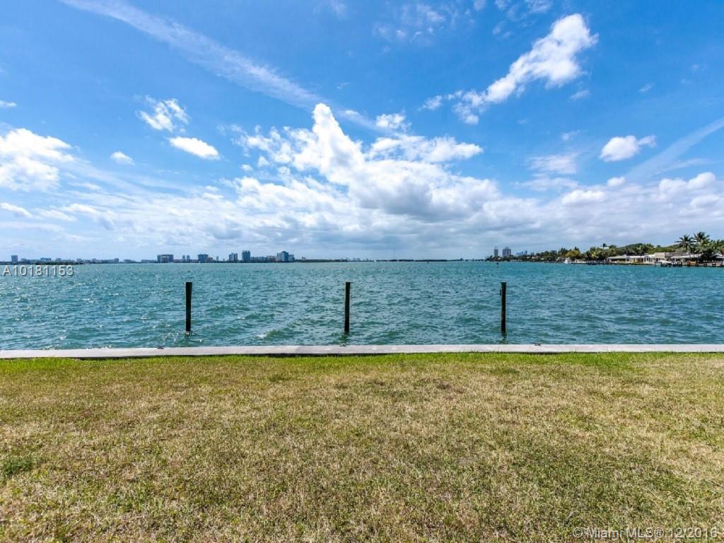 OVERSIZED WATERFRONT LOT with southern exposure towards Downtown Miami in Emerging Miami Shores NEIGHBORHOOD! Boaters enjoy 200 'of Open Bay water frontage on 1/2 Acre Lot. Inspired by Mid-Century Modern Architecture the Lot has APPROVED & PERMITTED PLANS by Architect Kobi Karp. Per owner planned estate has 6,640 sf of A/C living space, 2,738 SF open air living, 1,125 SF of terraces, 1,488 SF storage rooms + 4,980 SF of pool deck.