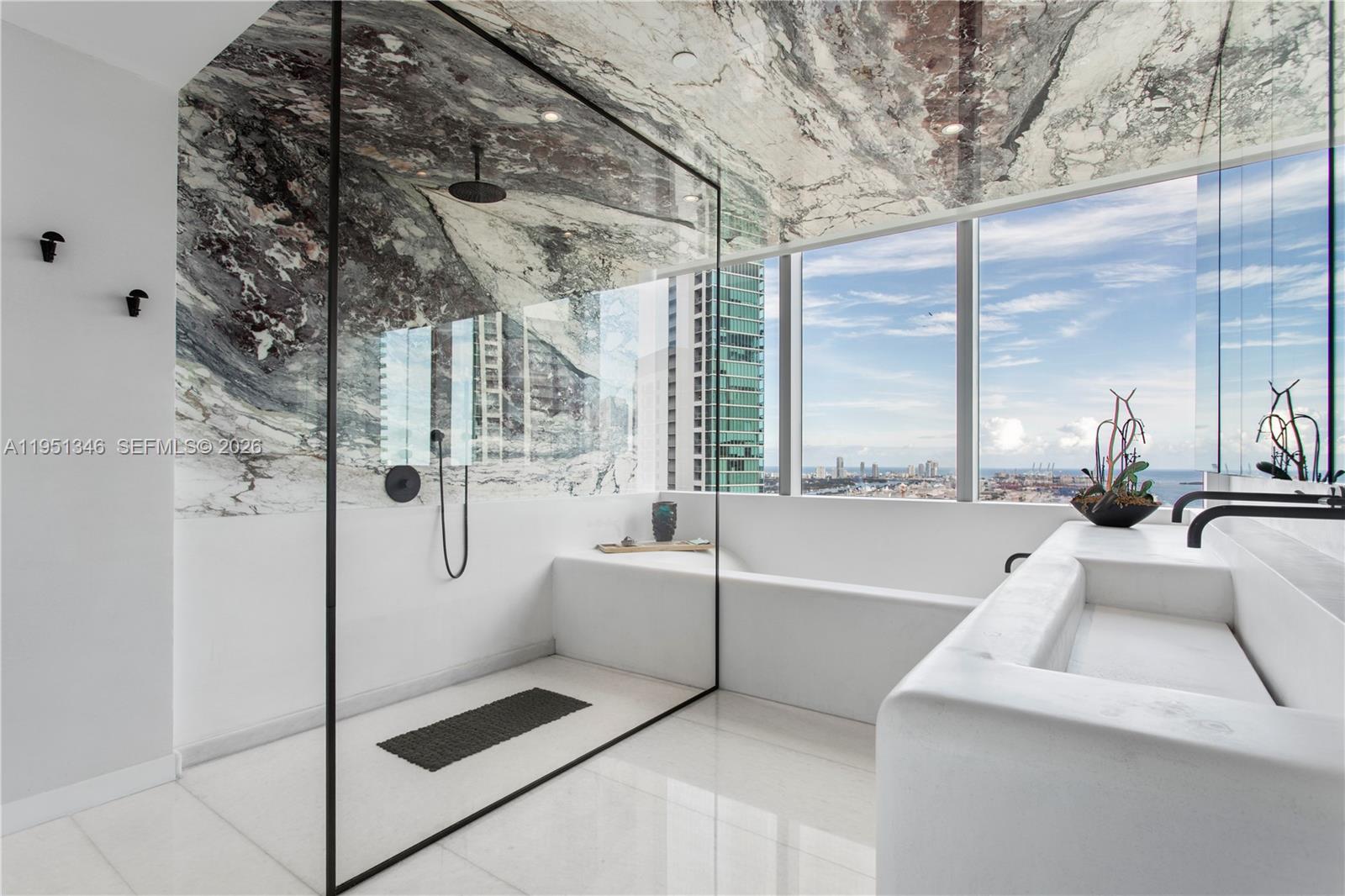 A rare turnkey unicorn at Paramount Miami World Center , fully reimagined with a refined custom buildout rarely seen in condominium living. This is not a standard residence. The original owner completed a full gut renovation immediately after closing, reconfiguring the layout to enhance scale, flow, and functionality. The result is the only 11 Line residence with a true formal dining room, also ideal as a media or billiards space. Designed by top New York and Florida firms, this one-of-one home features over $1M in curated upgrades including marble floors, sculptural plaster walls, bespoke ceilings with integrated linear air systems, Lutron, Sonos, and dramatic backlit onyx baths. Offered fully furnished with private cabana for immediate move-in-ready luxury without the time or cost of renovation.