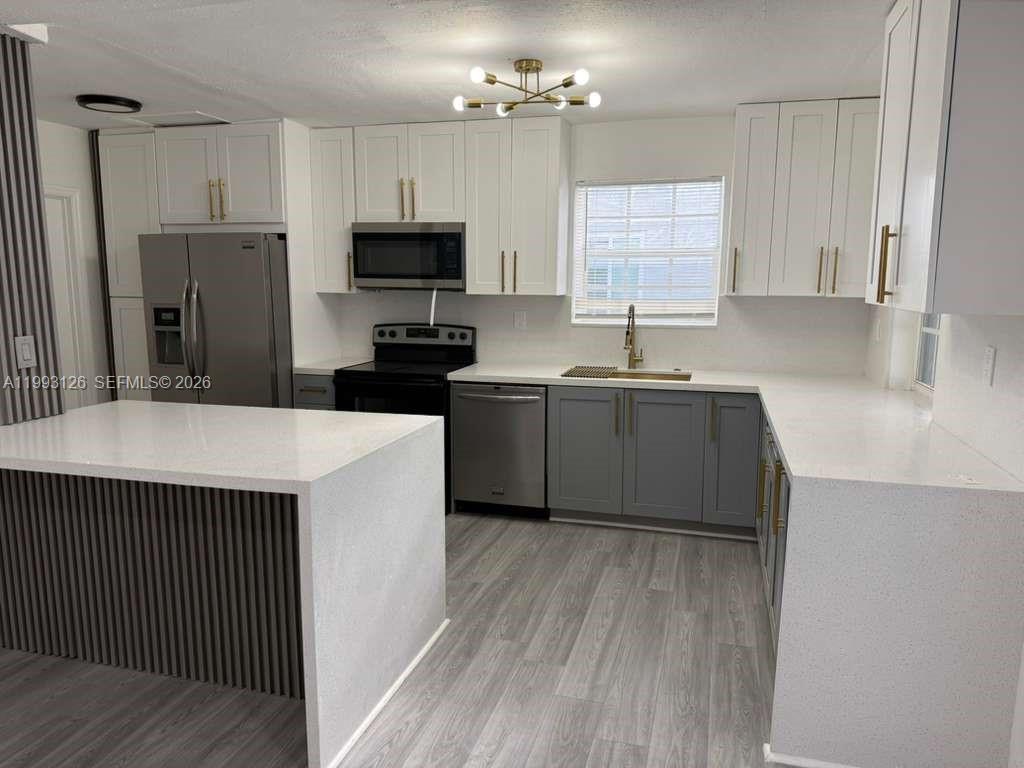 BEAUTIFULLY RENOVATED 4-BEDROOM, 2-BATH HOME FEATURING STYLISH MODERN UPGRADES THROUGHOUT. IDEALLY LOCATED JUST OFF DAVIE EXTENSION, NESTLED IN A QUIET, WELL-KEPT NEIGHBORHOOD WITH NO THROUGH TRAFFIC. THIS PARTICULAR PROPERTY SITS ON THE FINAL STREET, ENDING IN A PEACEFUL CUL-DE-SAC. ROOF IN GREAT CONDITION.

THE INTERIOR IS TRULY IMPRESSIVE, SHOWCASING A SLEEK KITCHEN WITH QUARTZ COUNTERTOPS, TWO-TONE CABINETRY ACCENTED WITH ELEGANT GOLD FINISHES, AND PORCELAIN TILE FLOORING THROUGHOUT THE HOME. THE BATHROOMS ARE EQUALLY UPGRADED, FEATURING CONTEMPORARY SHOWERS AND MODERN MIRRORS, BIG LOUNDRY ROOM.

STEP OUTSIDE TO ENJOY A SPACIOUS BACKYARD WITH A LARGE IN-GROUND POOL, PERFECT FOR RELAXING OR ENTERTAINING. THIS HOUSE IS CONVENIENTLY LOCATED NEXT TO THE TOWN OF DAVIE, OFFERING ENDLESS OPTIONS FOR SHOPPING, DINING, PARKS, AND RECREATIONAL ACTIVITIES.

NO HOA AND NO RENTAL RESTRICTIONS, MAKING THIS PROPERTY IDEAL FOR HOMEOWNERS AND INVESTORS ALIKE.