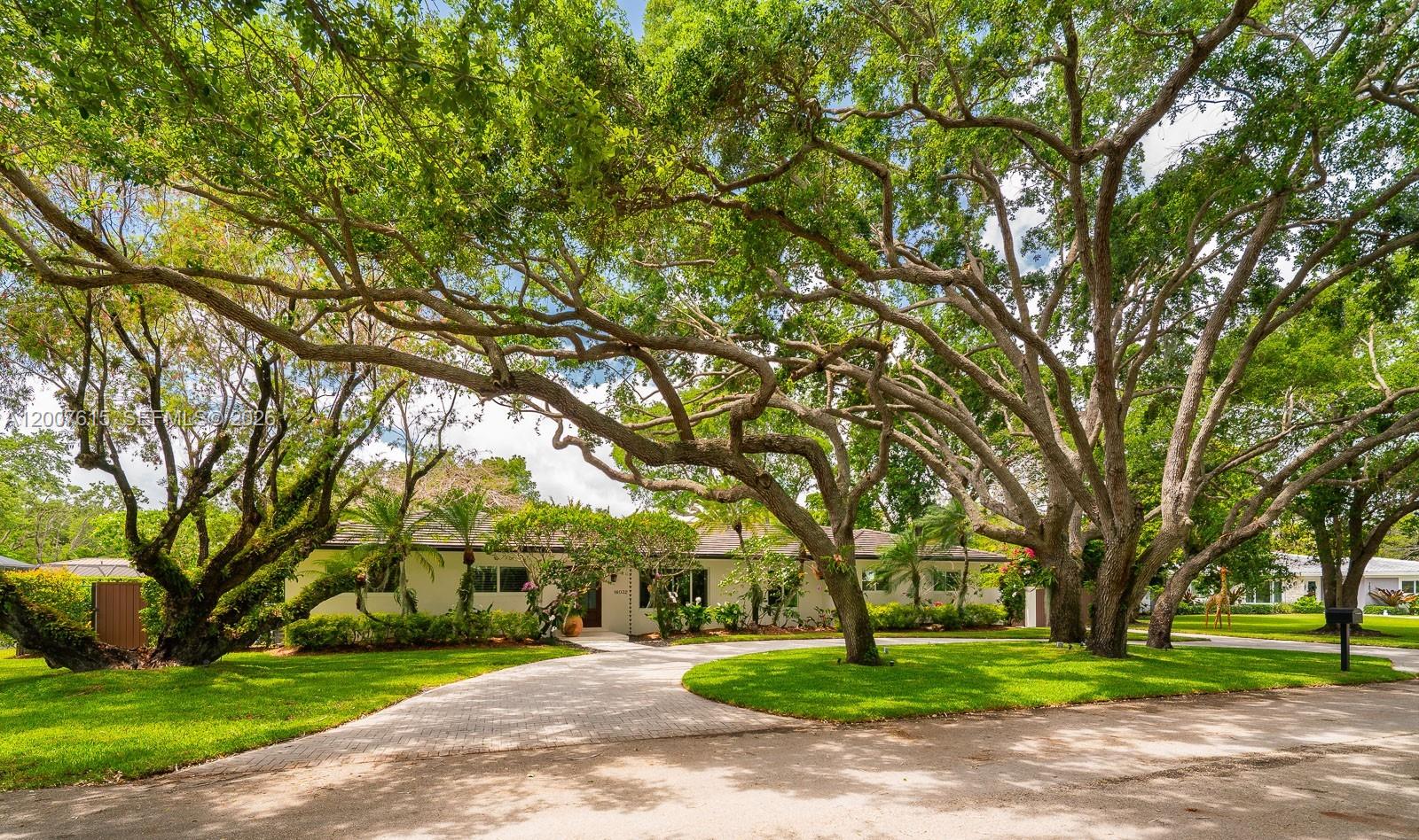 This exceptional 4-bedroom, 2.5-bath home is ideal for comfort, entertaining, and outdoor living. Ideally located near top-rated public and private schools, parks, shops, and bike paths, it is tucked away at the end of a quiet cul-de-sac with minimal road traffic. The spacious primary suite features his-and-hers walk-in closets and an en-suite bath with dual sinks, dual shower heads, and a separate tub. The large kitchen boasts wood cabinetry, granite countertops, and a generous breakfast nook. The open living, dining, and family areas offer easy flow, with disappearing sliding glass doors connecting indoor and outdoor living. Step outside to a covered screened enclosure that helps keep bugs out and enjoy the large patio—perfect for entertaining—with its built-in grill and bar and easy access to the kitchen, plus a sparkling pool for relaxing and fun. The fenced backyard provides added privacy. The home also includes a dedicated laundry room with cabinetry and a utility sink. All windows and doors are impact-resistant, and the home has a concrete tile roof (2019).