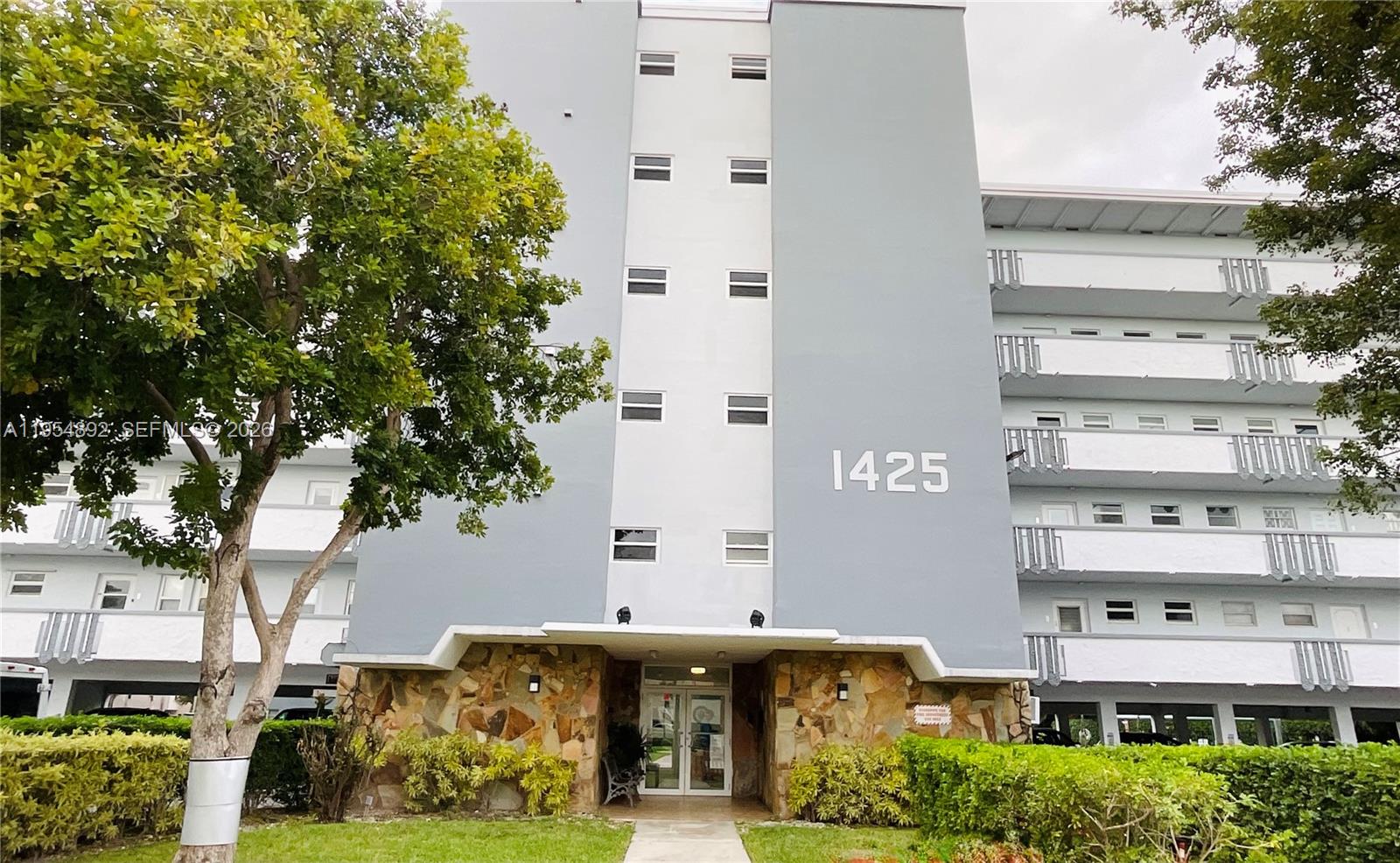 Located in a beautiful 55+ community, this two-bedroom, two-bathroom residence offers a spacious and bright interior. The primary bedroom features a private bathroom, a walk-in closet, an additional closet, and private access to the balcony. The living area includes a well-lit living room and dining space, while the kitchen has its own separate entrance.  The screened balcony offers a stunning view of the garden and pool, making it an ideal space to relax and unwind.  The building is exceptionally well maintained, featuring a newly paved parking lot, fresh exterior paint, and has successfully passed its 50-year inspection. The unit includes impact windows for added protection and is located on the second floor, accessible by both stairs and elevator.  The location is highly convenient—just minutes from the beach, with plenty of shopping, dining, and services nearby.  Maintenance is excellent and includes amenities such as a pool, gym, sauna, and clubhouse. Washers and dryers are available on every floor, and rent includes water, trash, pest control, and a covered parking space.  The property can be rented furnished or unfurnished, depending on your preference.